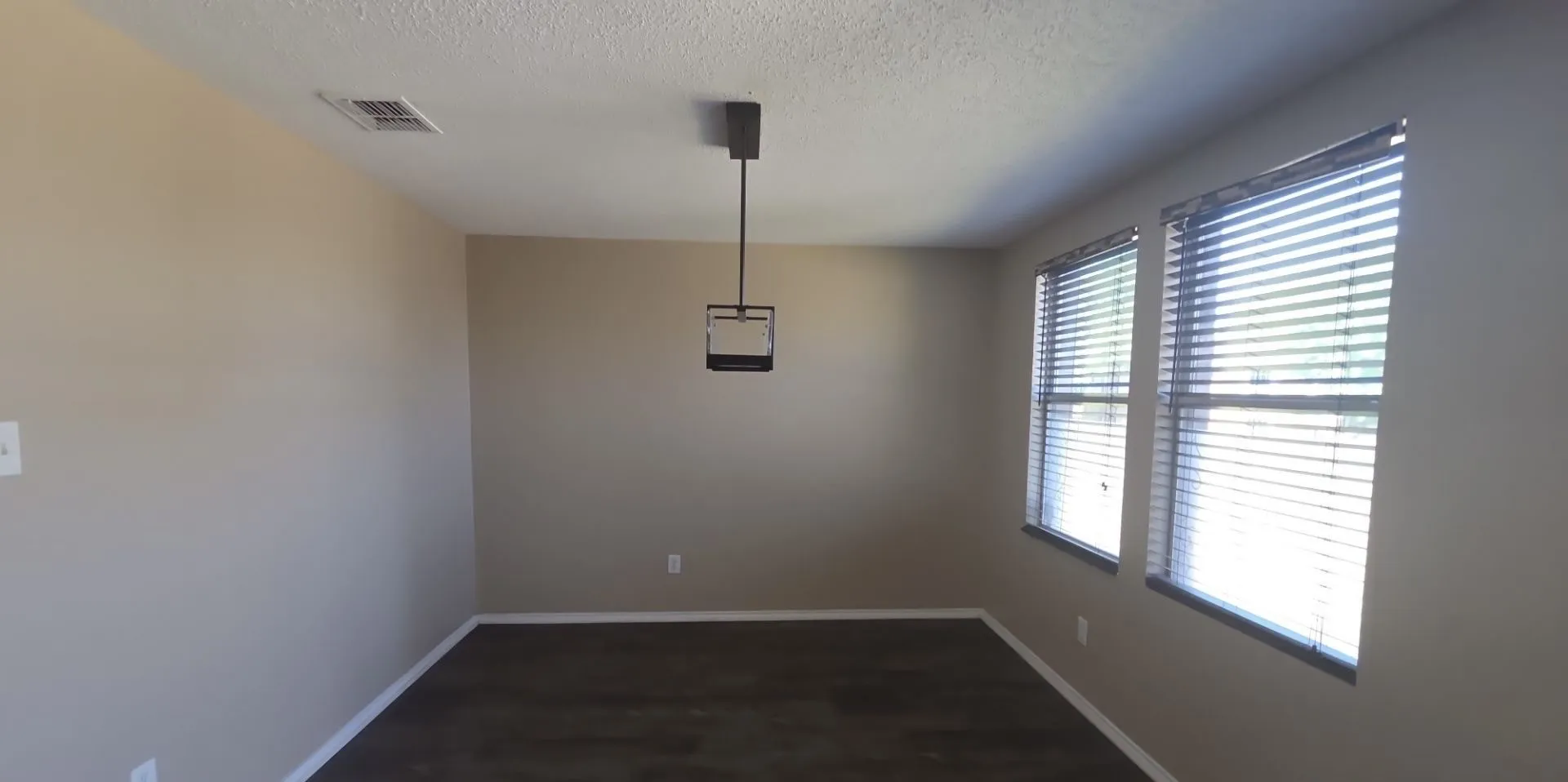 Recessed lighting, wood-finish flooring, and multiple windows