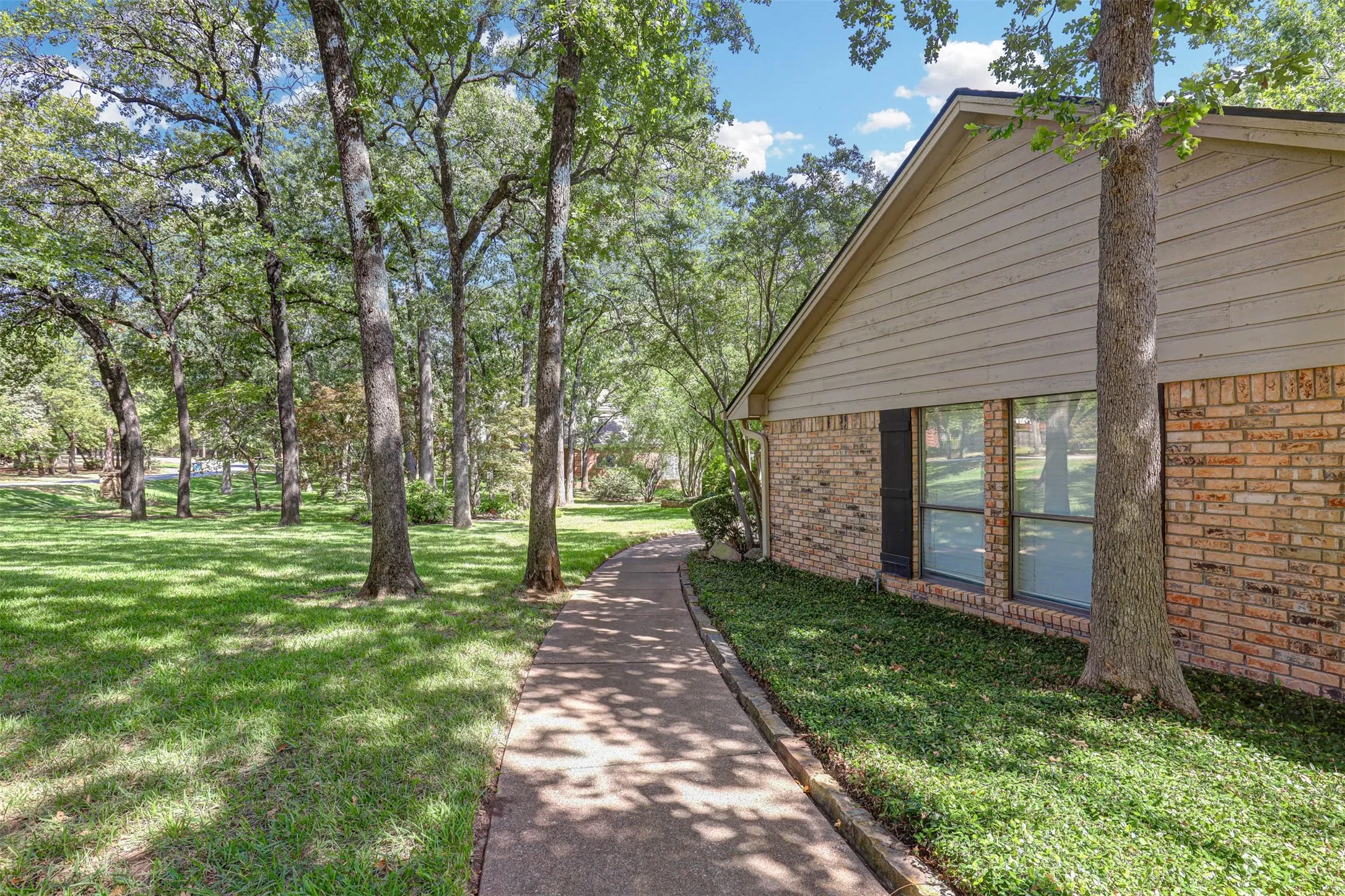 Shaded side walkway connecting to the front entry.