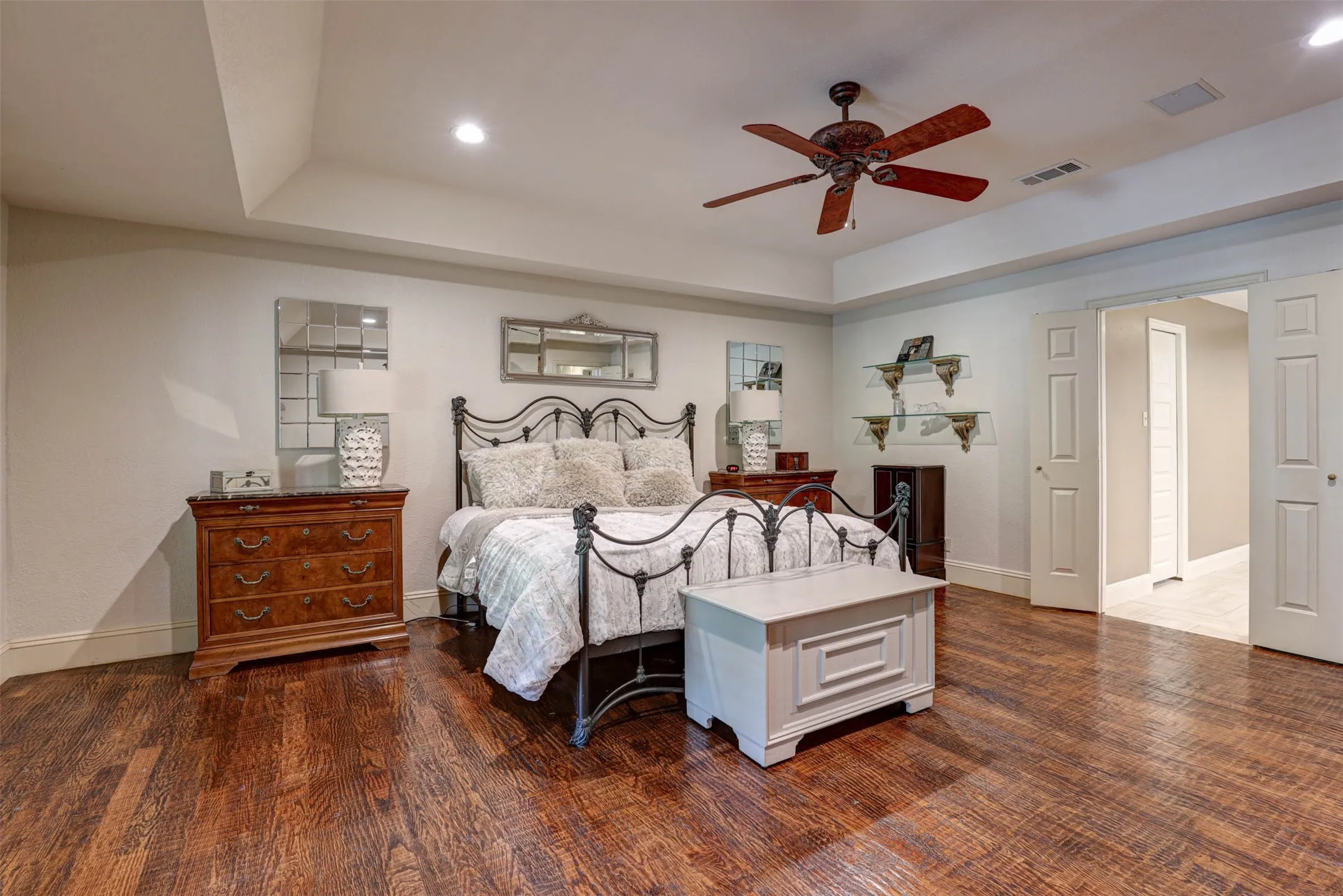 Primary bedroom with direct access to the ensuite bath.