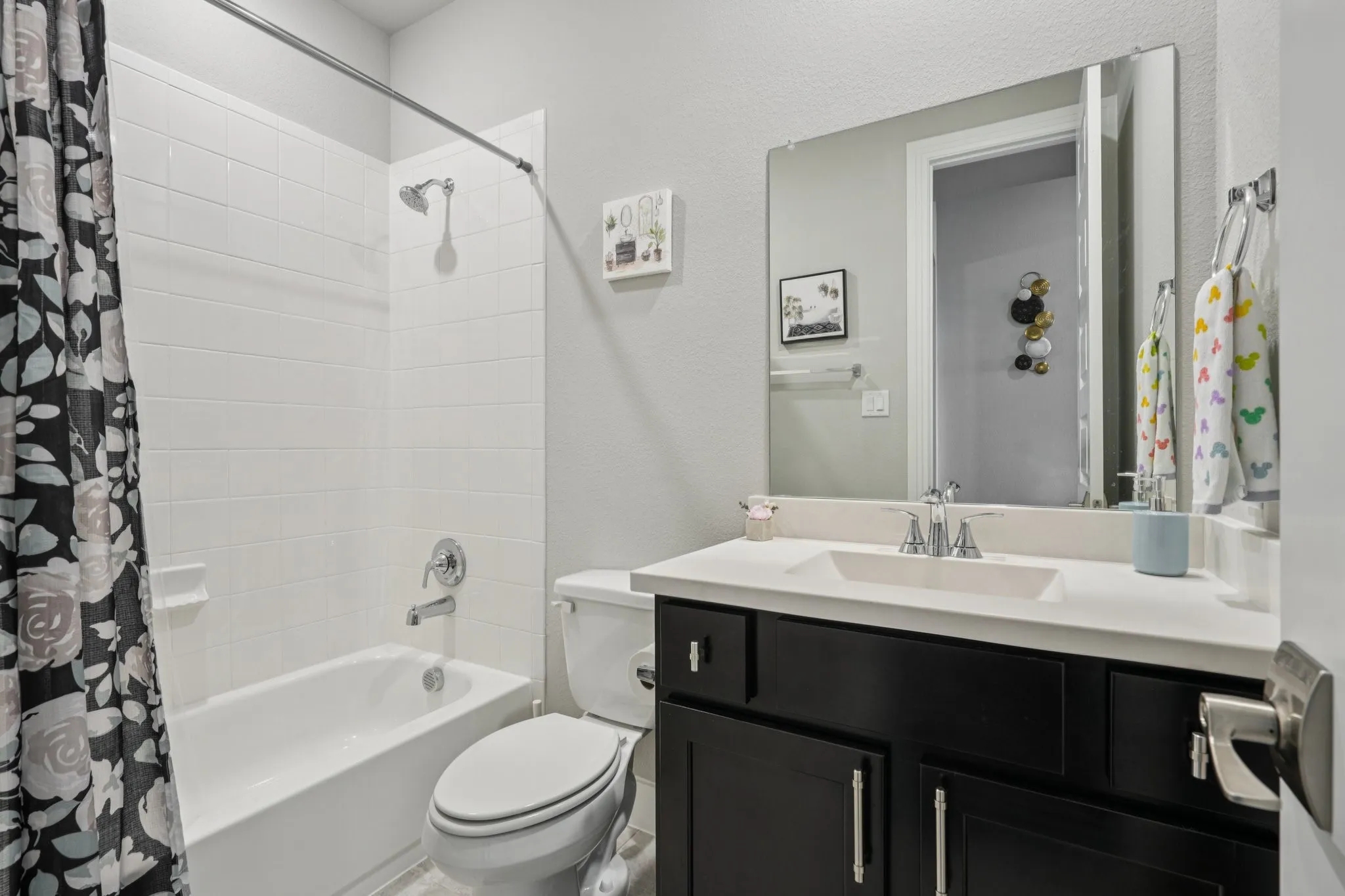 White subway tile bath/shower surround with chrome fixtures