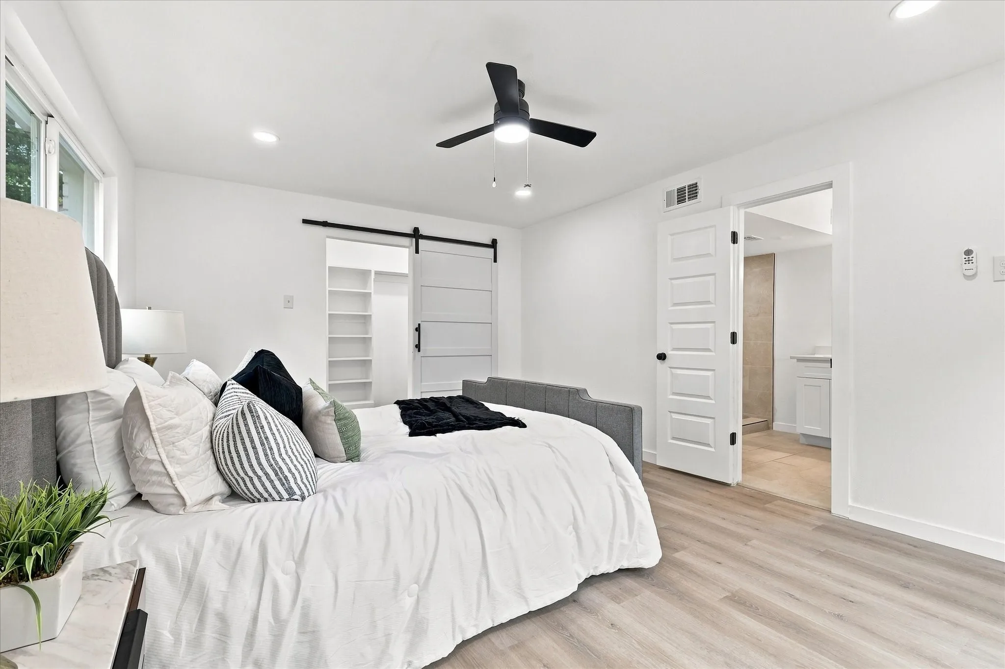 Light wood-finish flooring with recessed lighting
