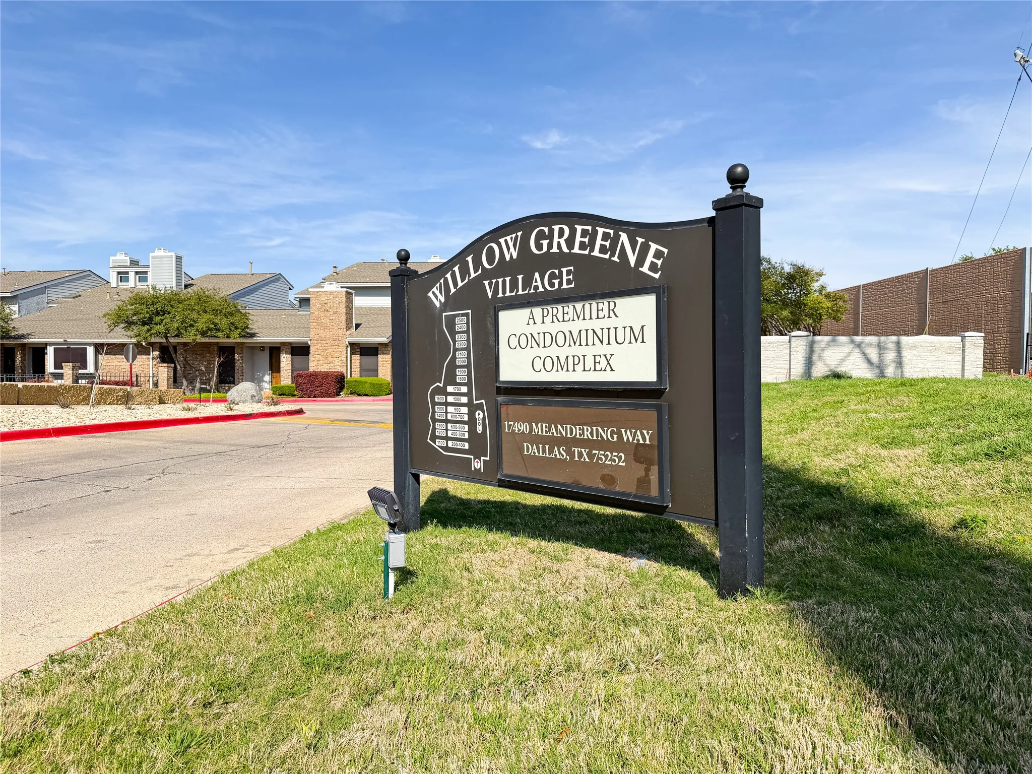 Willow Greene Village condominium complex signage with property address