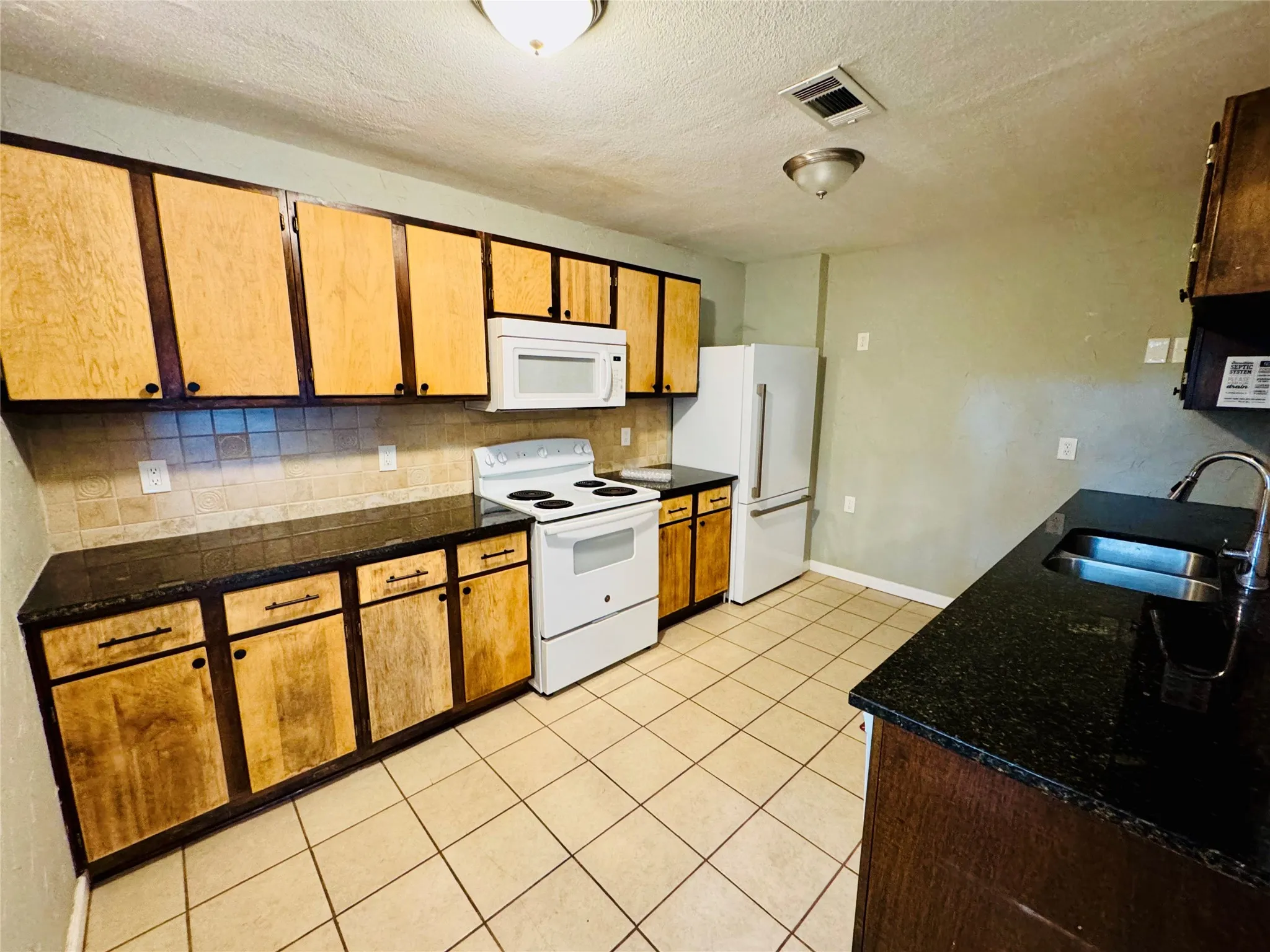 Lots of cabinets, galley kitchen