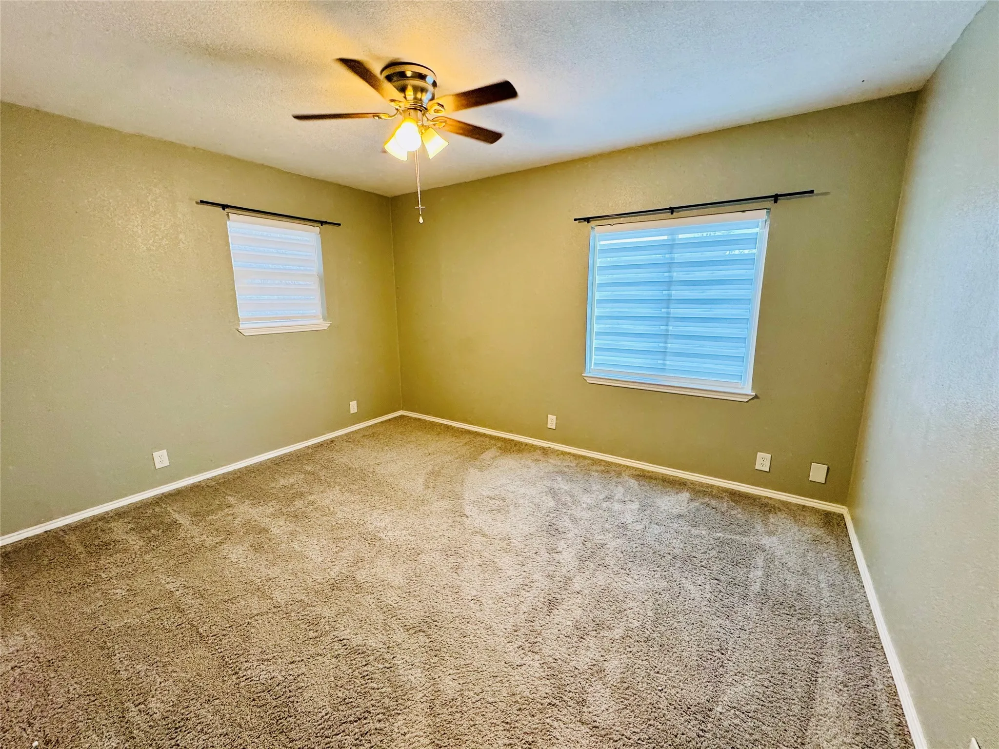 Bright bedroom with ceiling fan