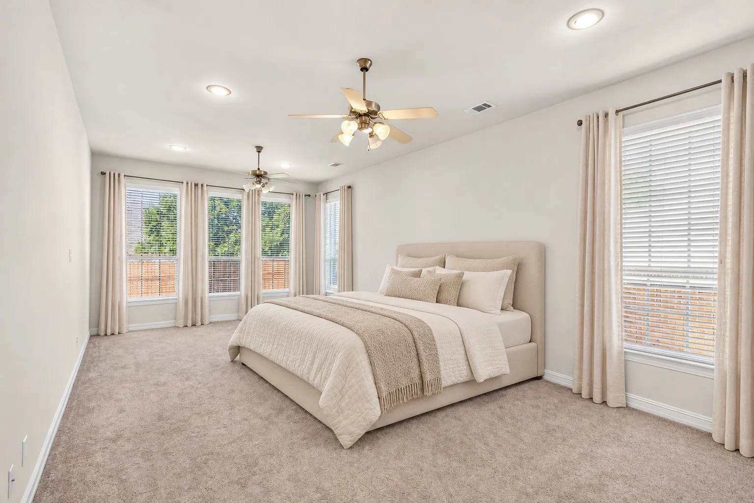 Large primary bedroom, large enough for a sitting area or crib