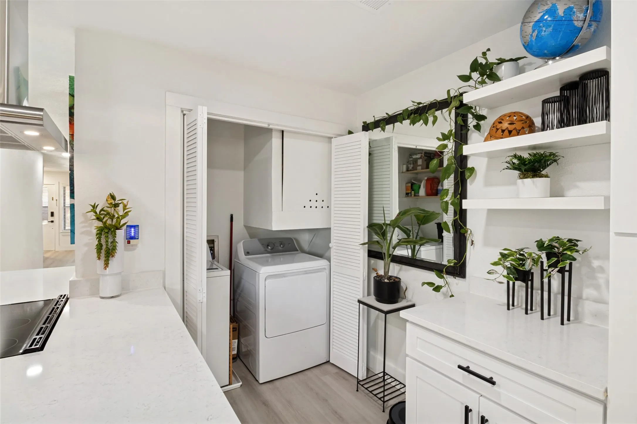 Integrated laundry area with a full-size washer and dryer