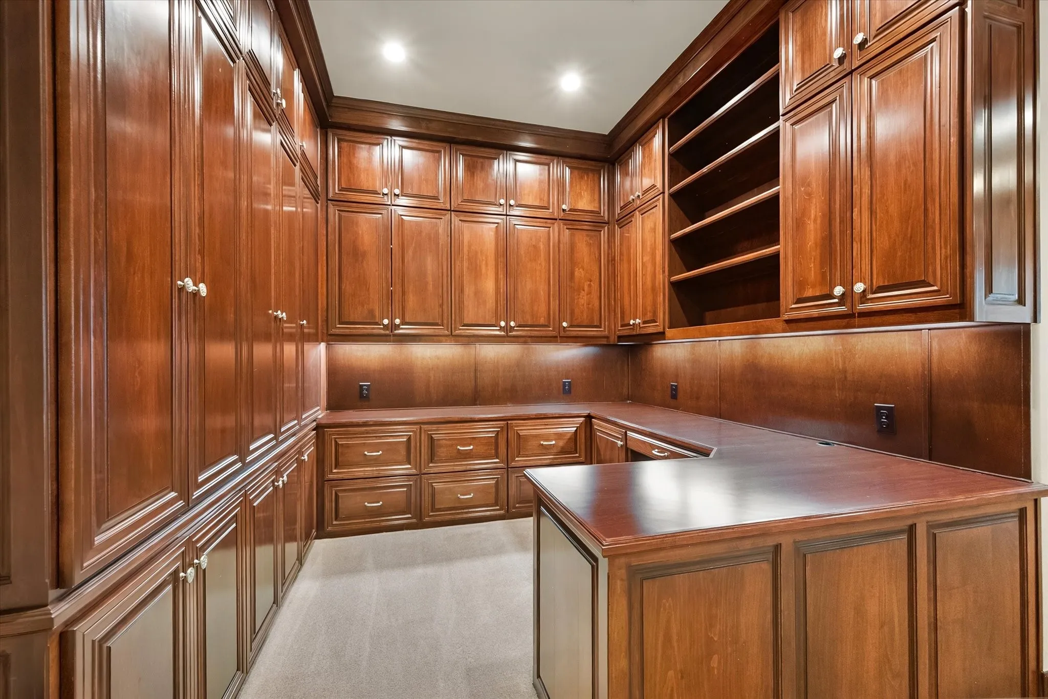 Office at Home! Extensive wood cabinetry, built-in shelving, wood-finish countertops, recessed ceiling lighting, and under-cabinet lighting