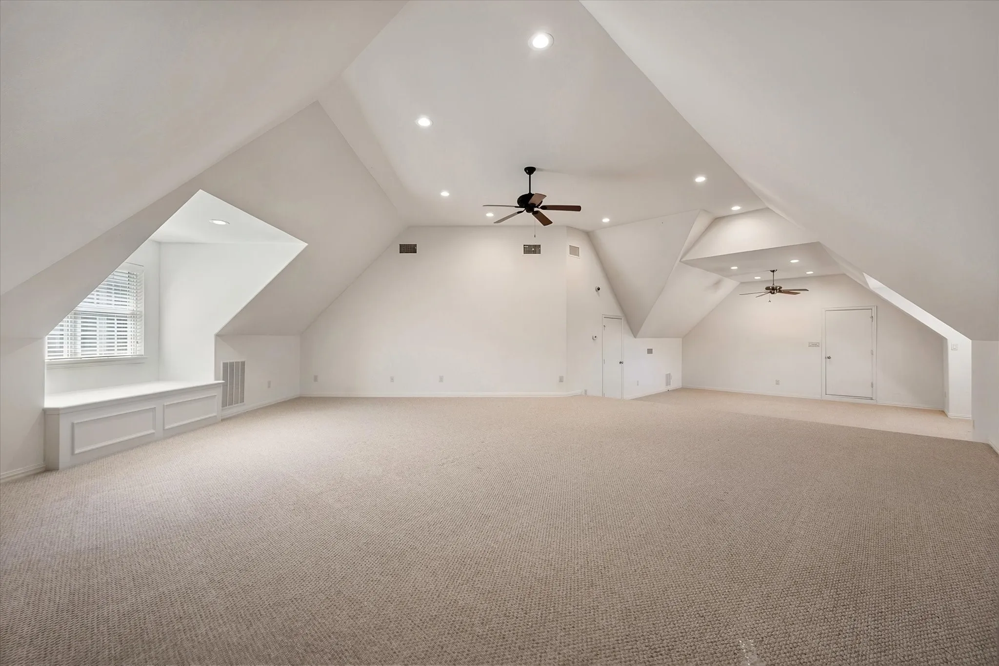 AC, finished living area with private entrance and carpeted area with recessed lighting, angled ceilings, and two ceiling fans