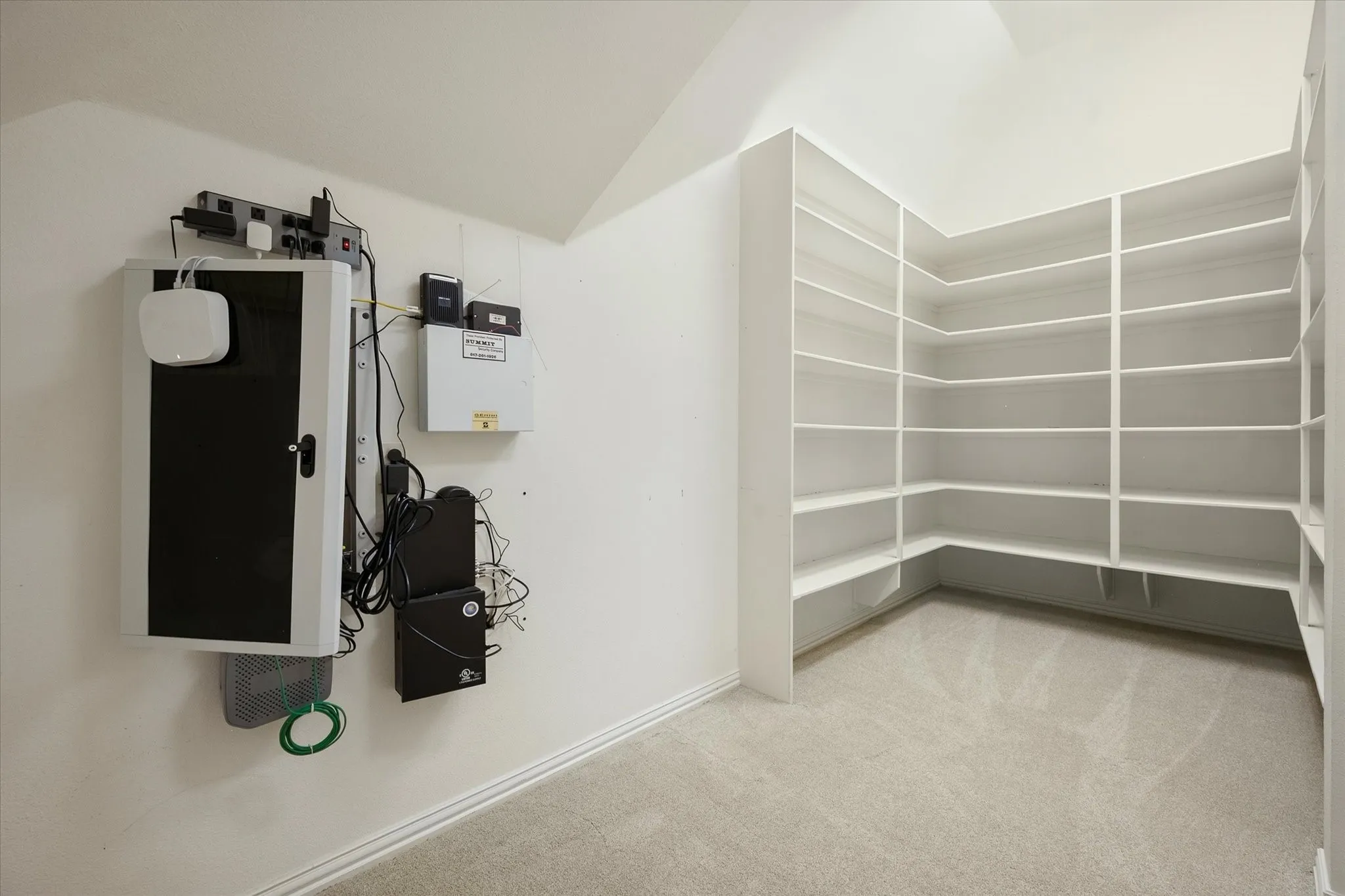 Built-in custom shelving, neutral carpeting