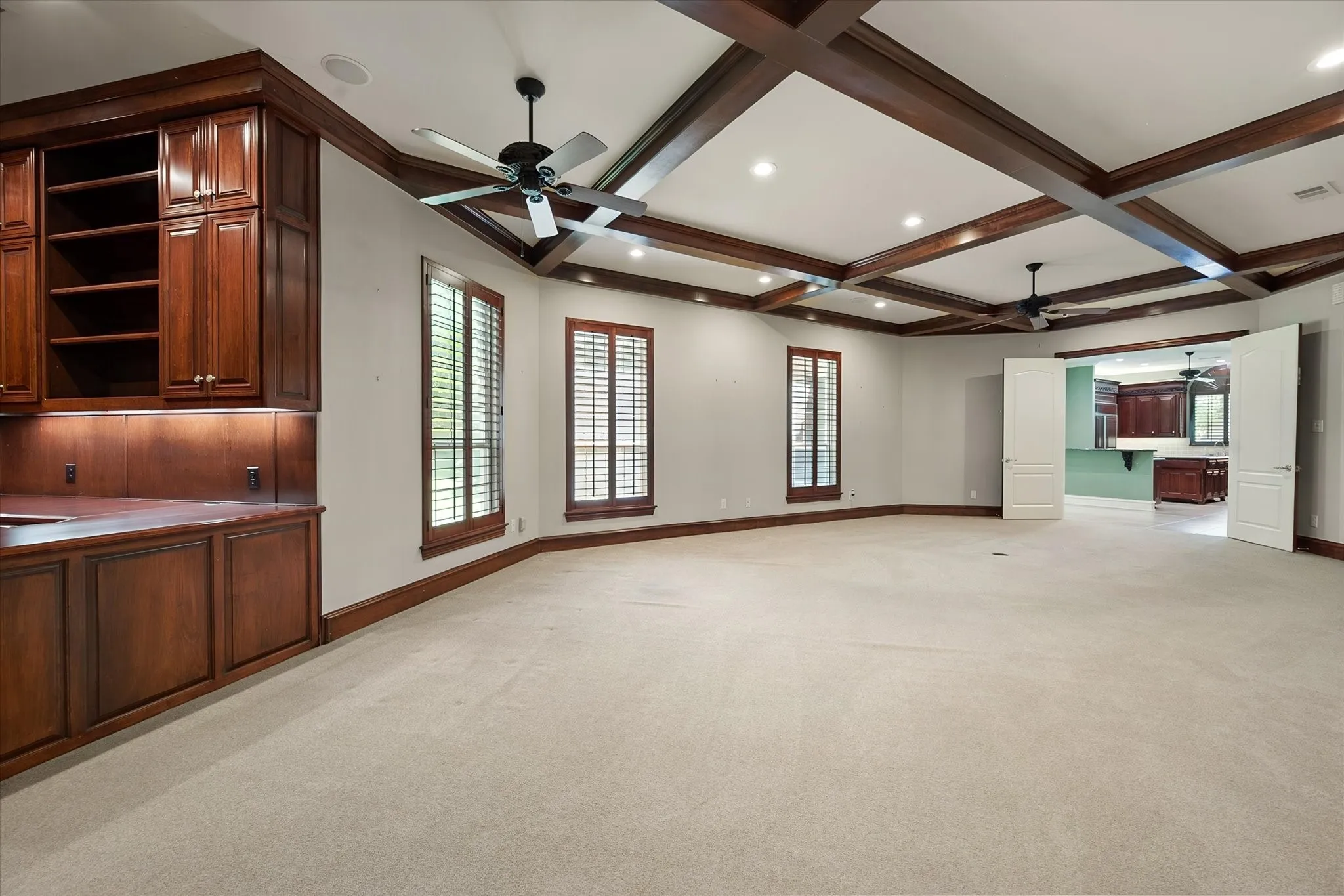 Expansive Family Room with recessed lighting and ceiling fans. Entertain, or relax in this oversized living area