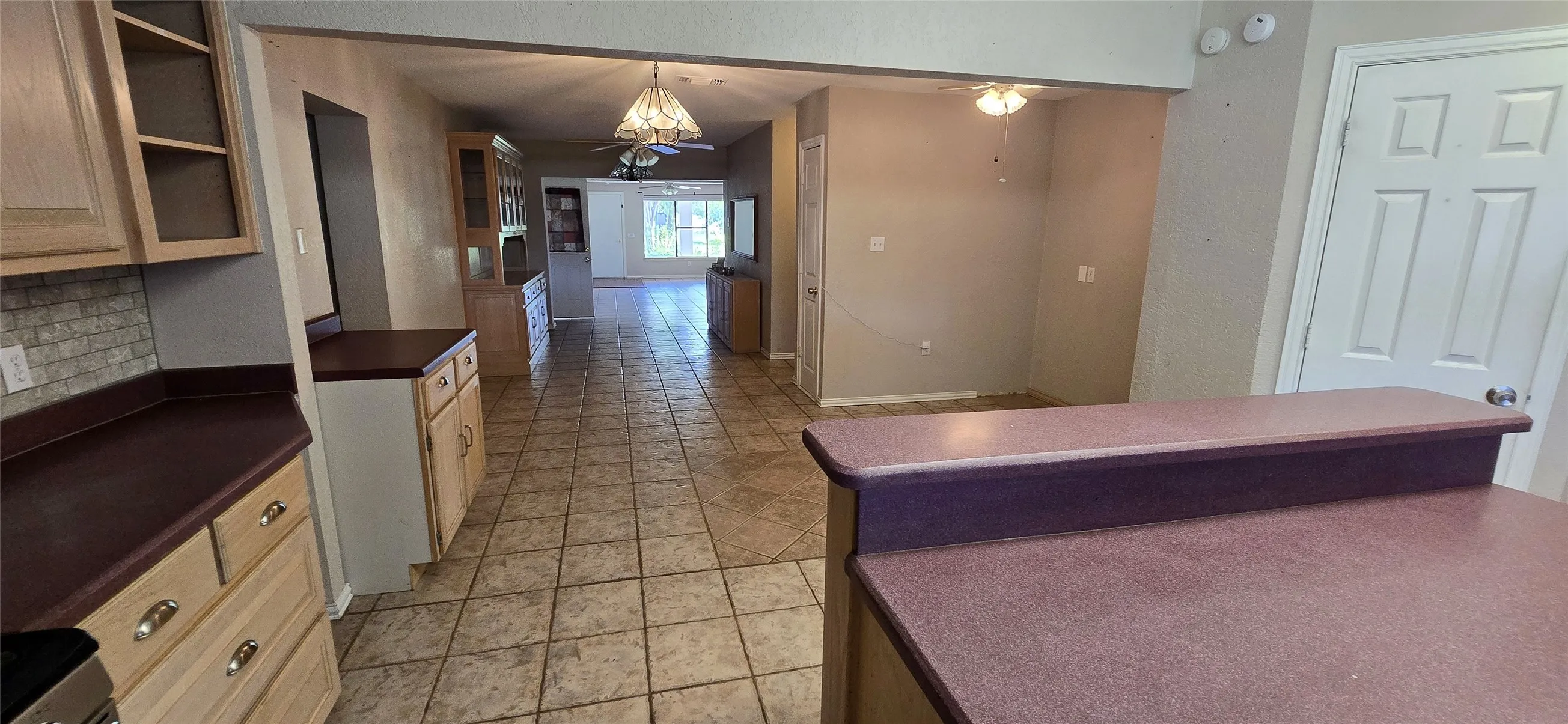Open-concept layout with tile flooring