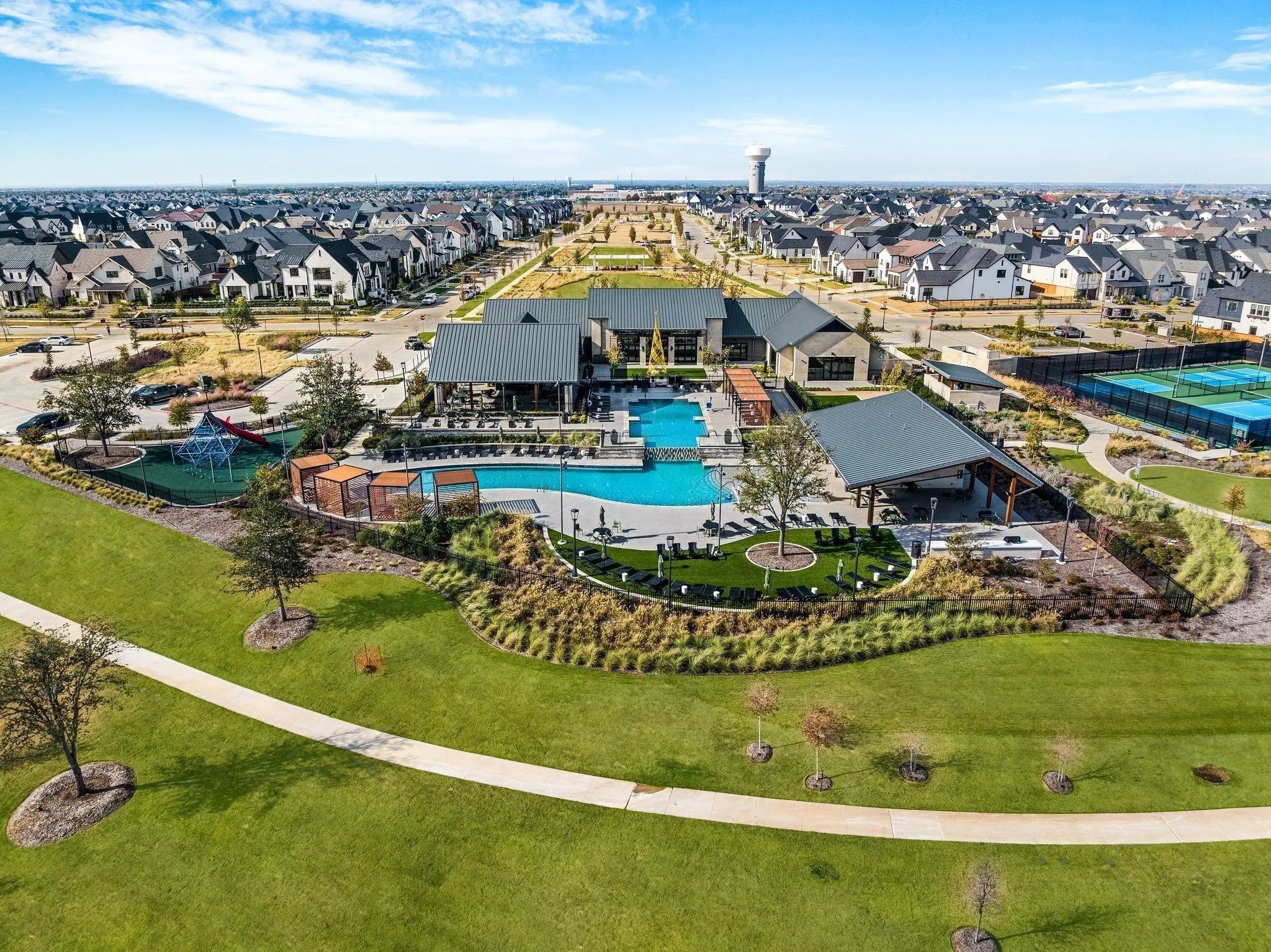 Expansive community greenspace with walking paths