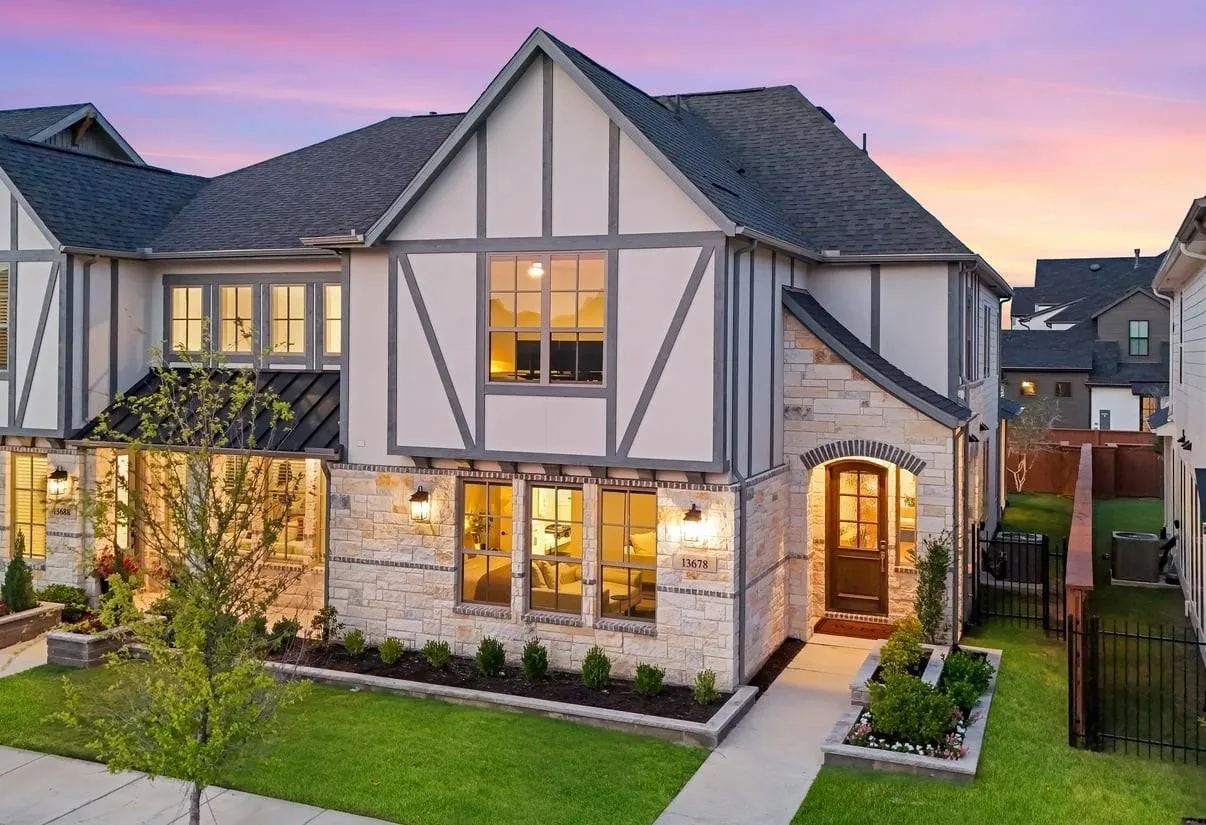 Stone and stucco exterior with dark trim accents
