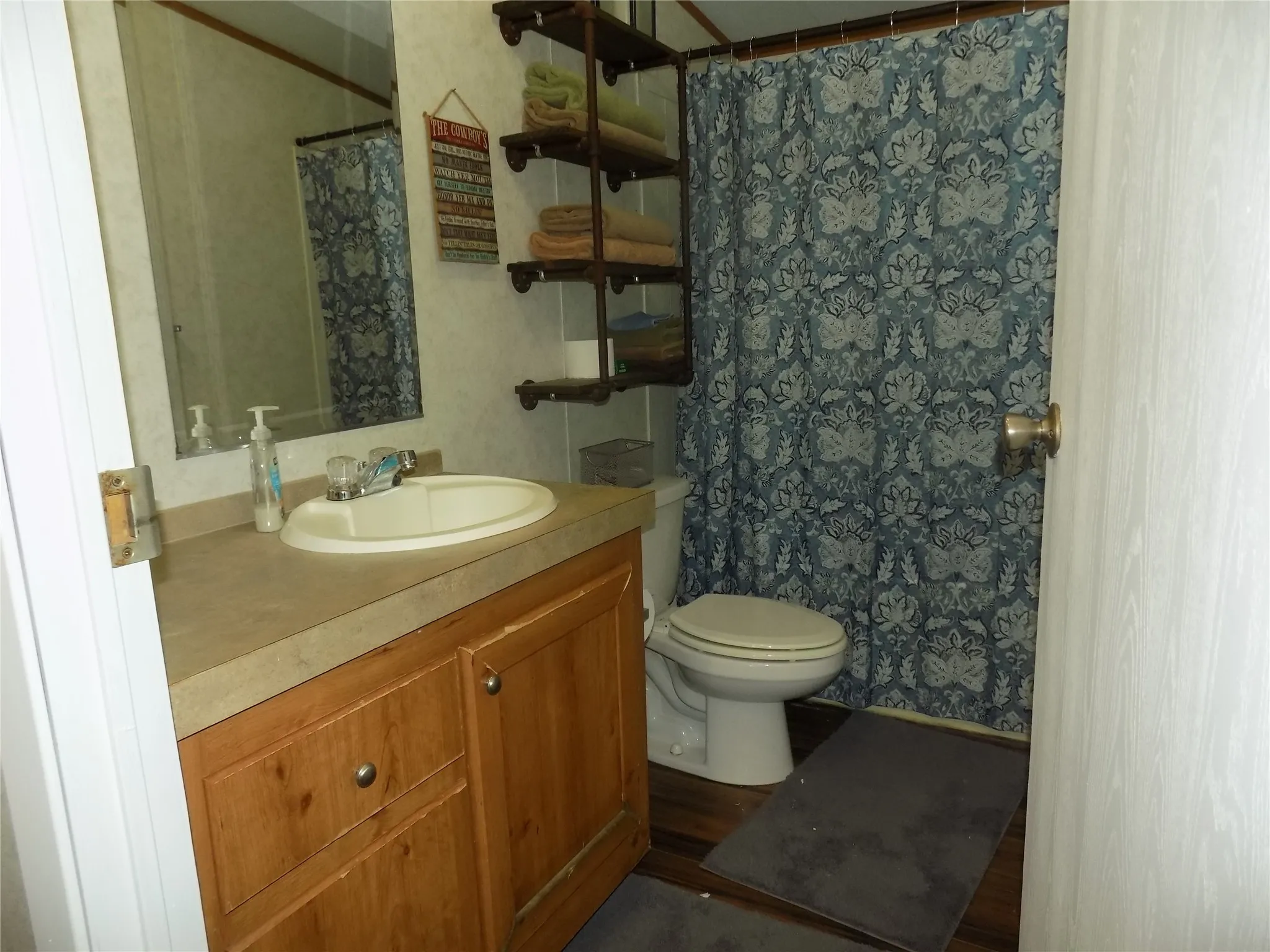 Guest bathroom located conveniently to secondary bedrooms.