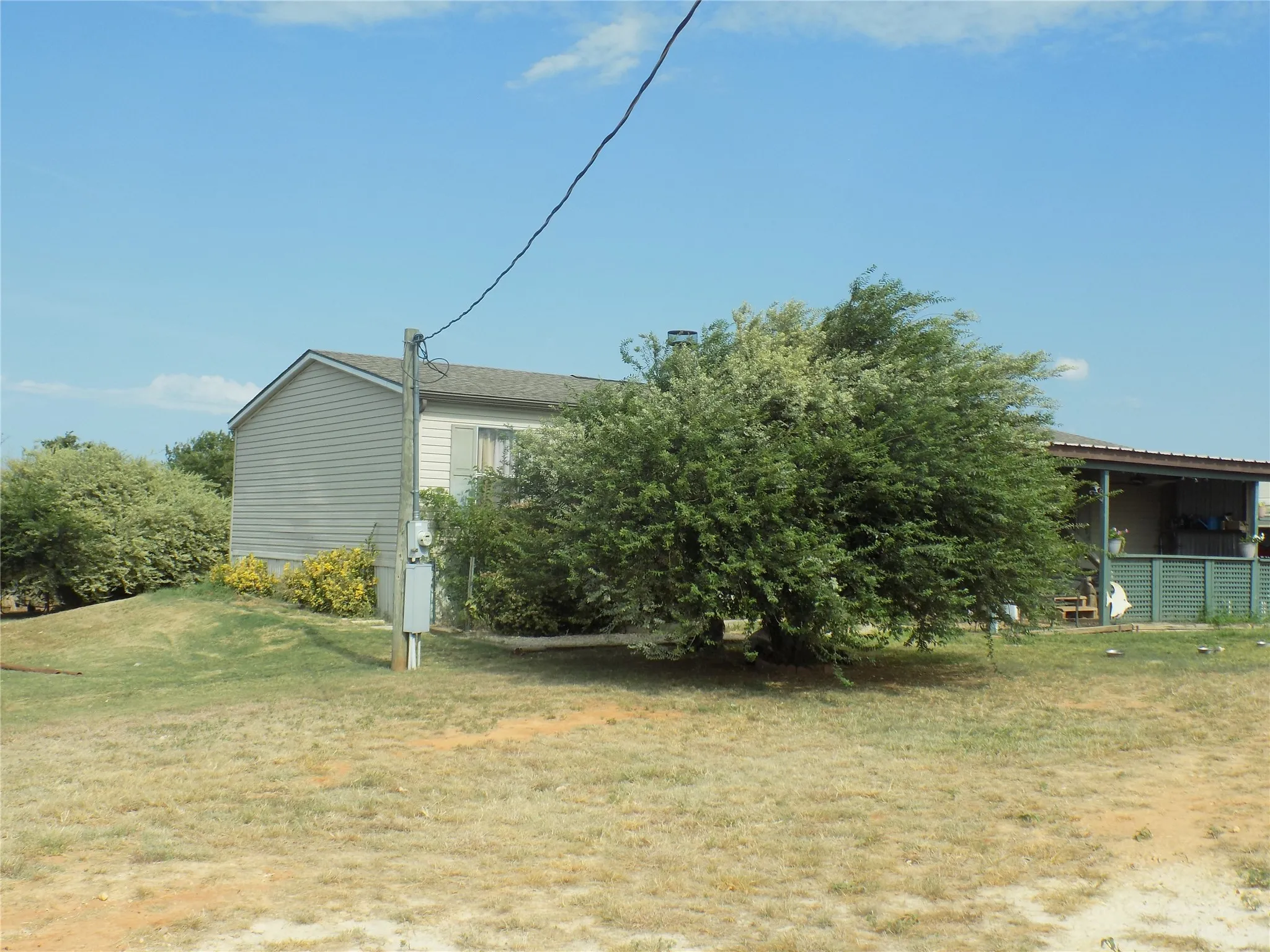Second acre lot is to the left of existing home, facing from the road.