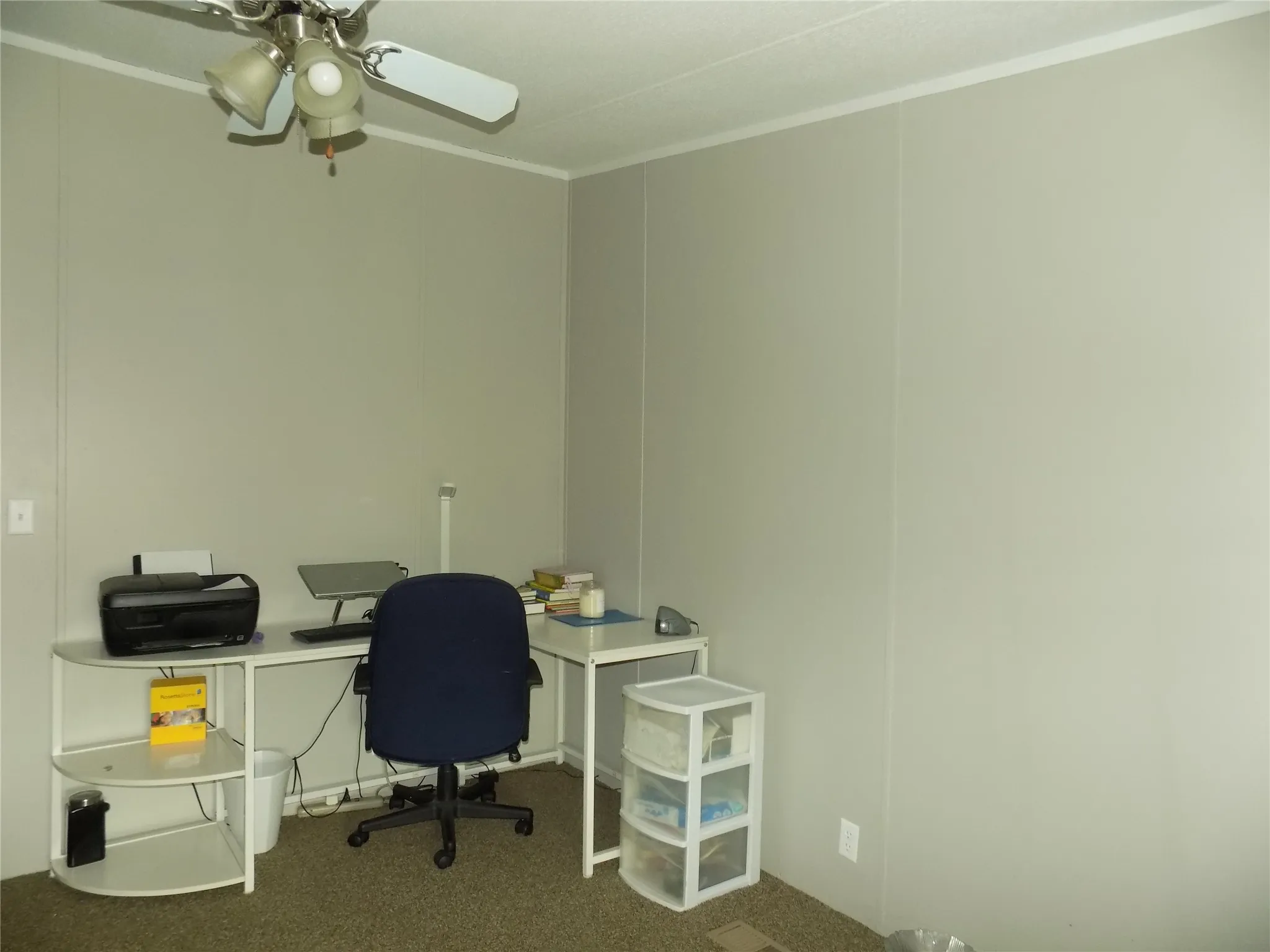 Space enough for computer set-up in bedroom, with celling fan and lights.