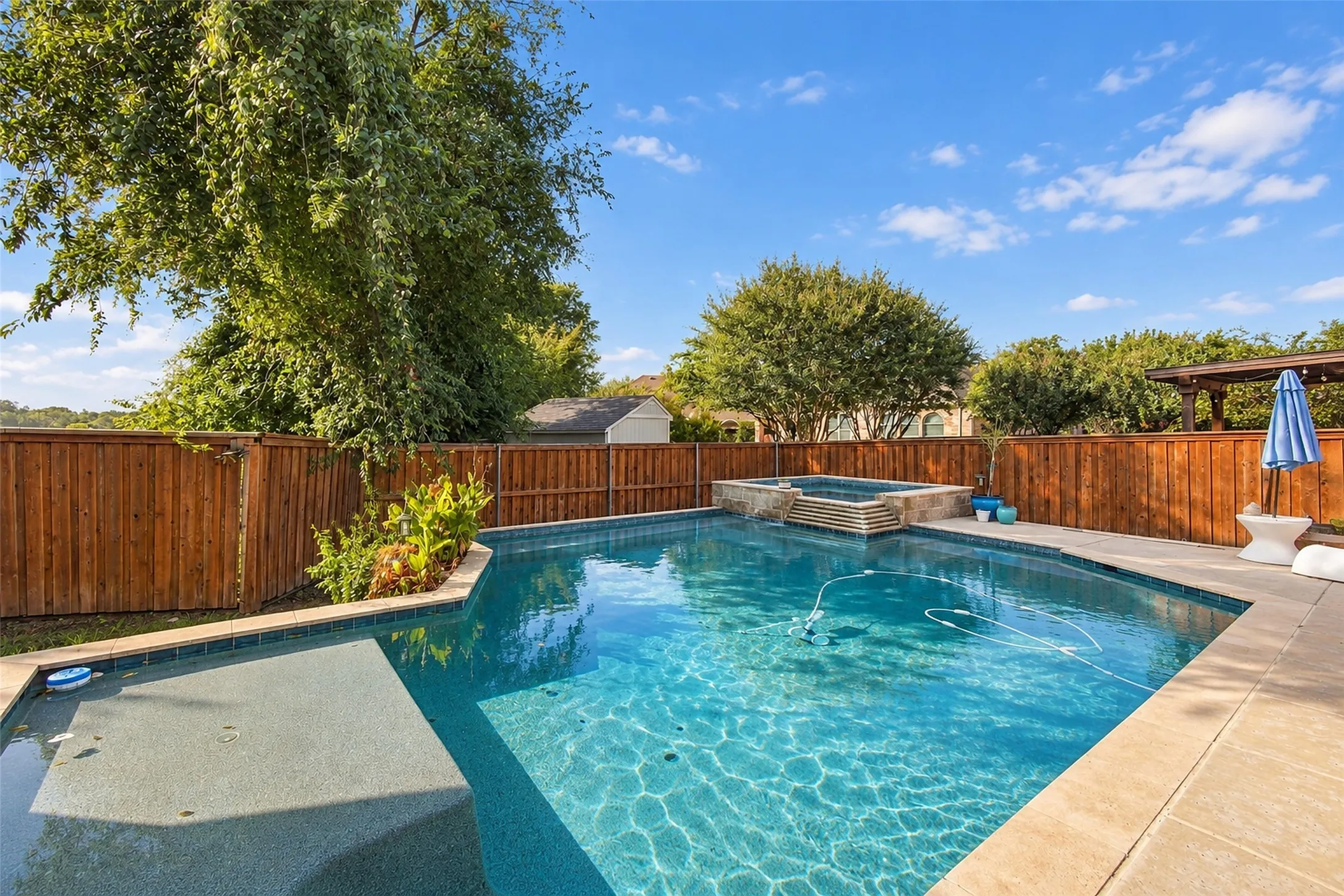 Gorgeous pool with tanning ledge.