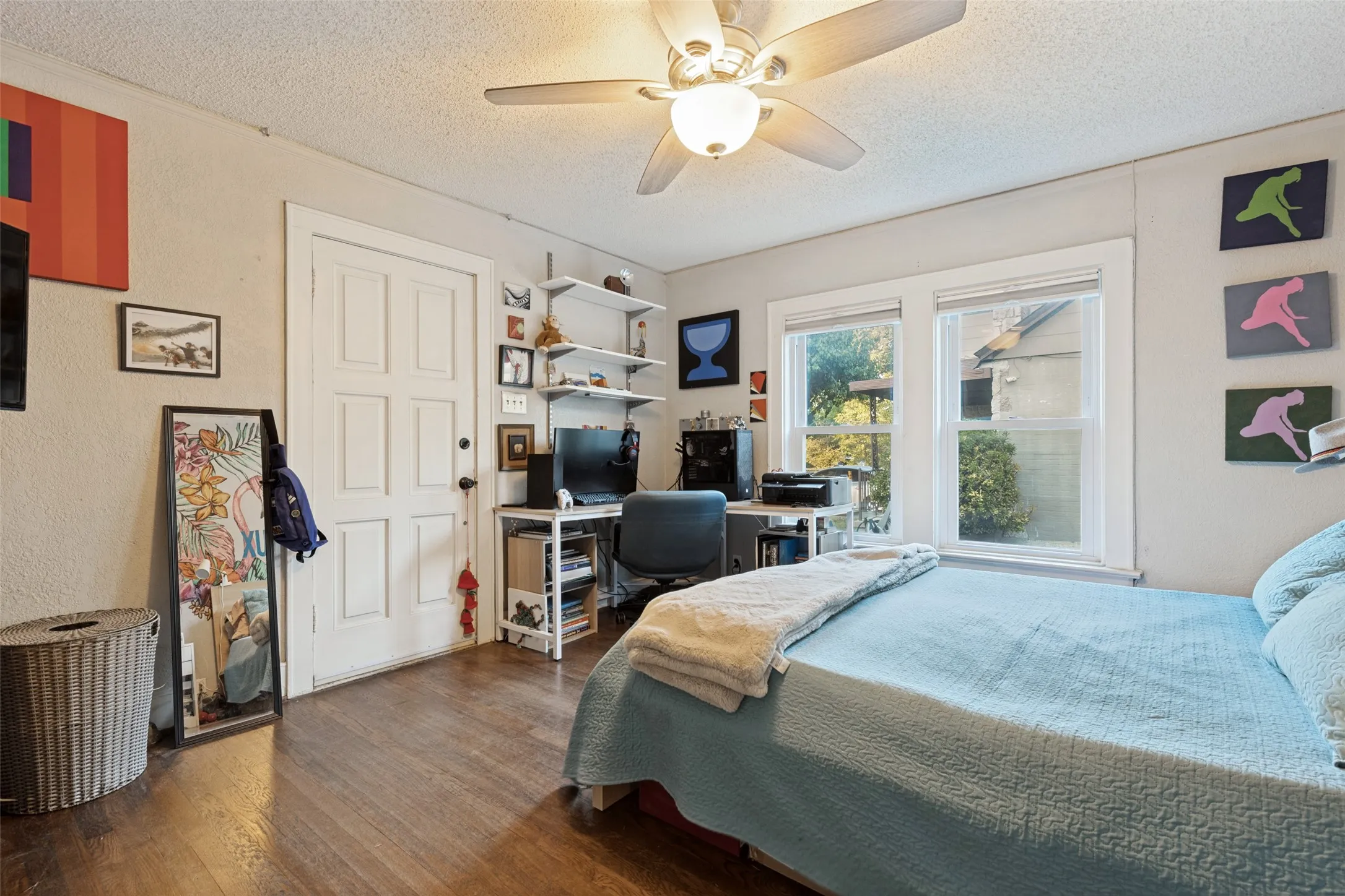 The Second Bedroom offers hardwood floors, great natural light, and a Walk-In Closet—a welcome surprise in a home of this era. It includes an exterior door for direct access to the Front Porch.