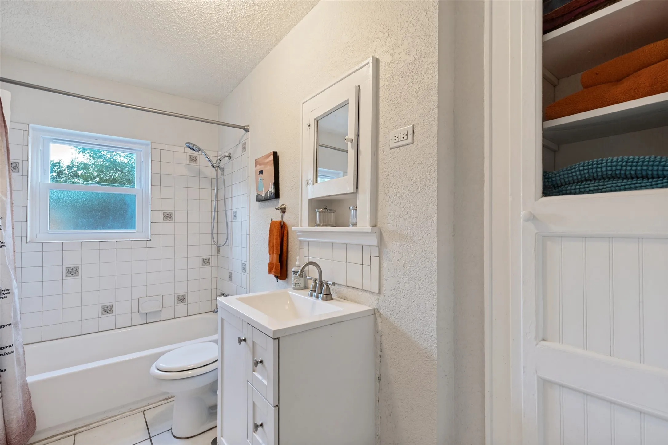 The Main House Full Bath keeps things simple and charming with crisp finishes and period-inspired details.
