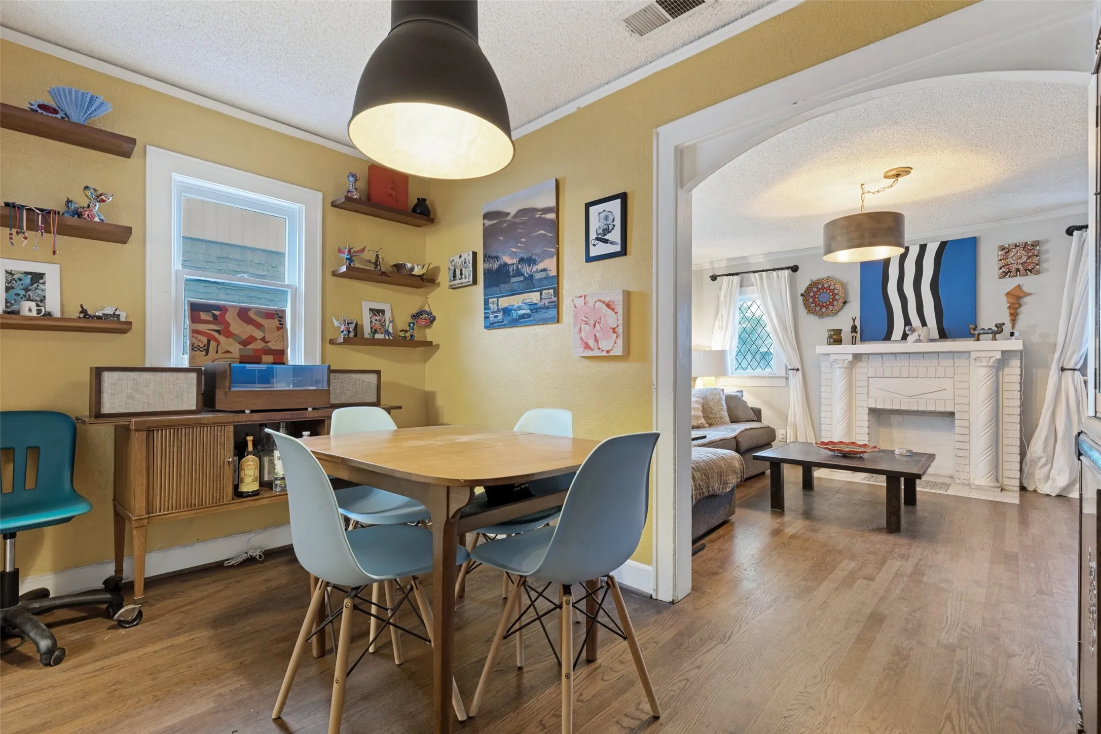 Period architecture meets everyday livability as the Dining Room opens beautifully to the Living Room.
