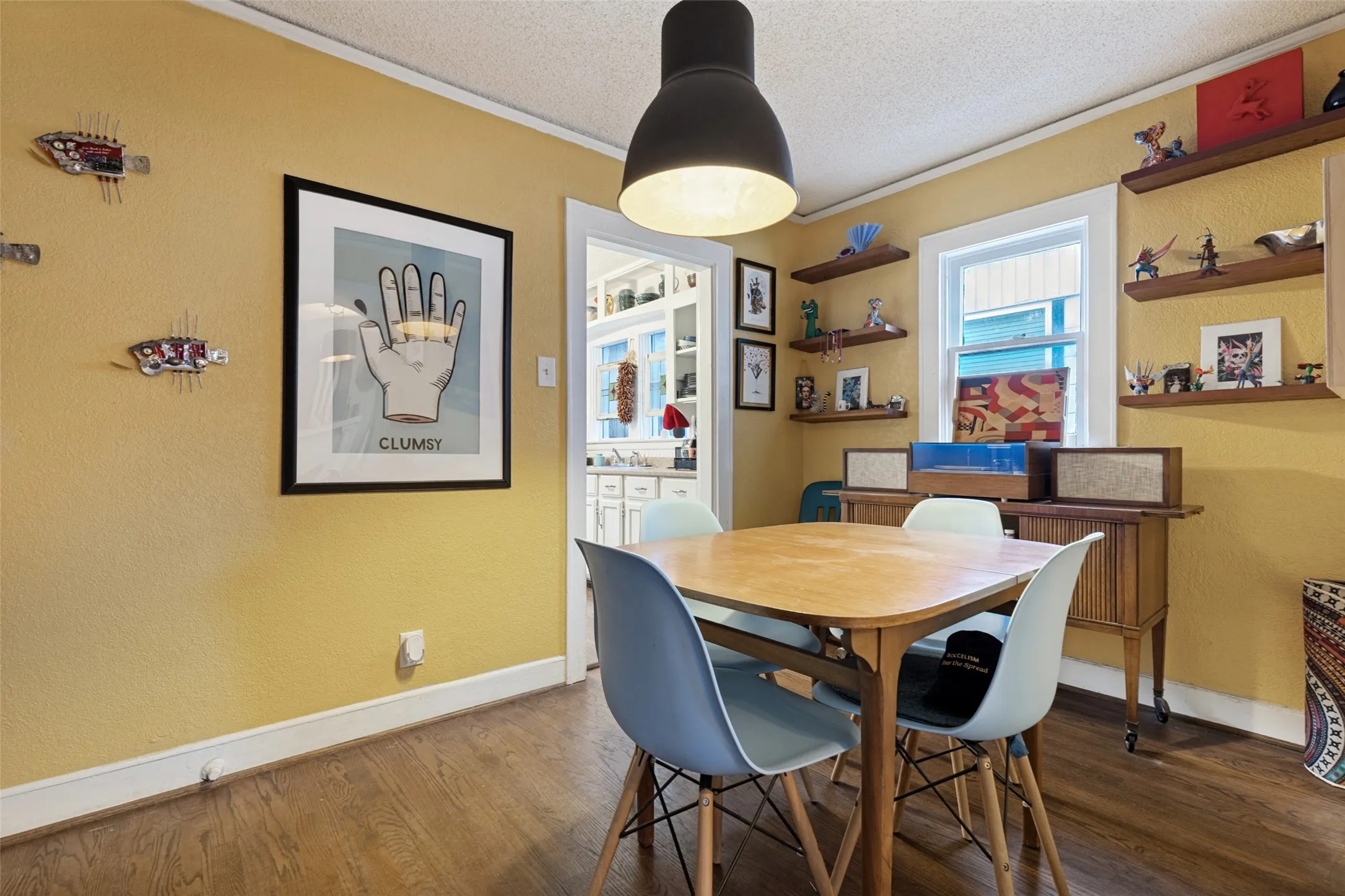 An inviting Dining Room with a collected mood and easy connection to both the Living Room and Kitchen.

