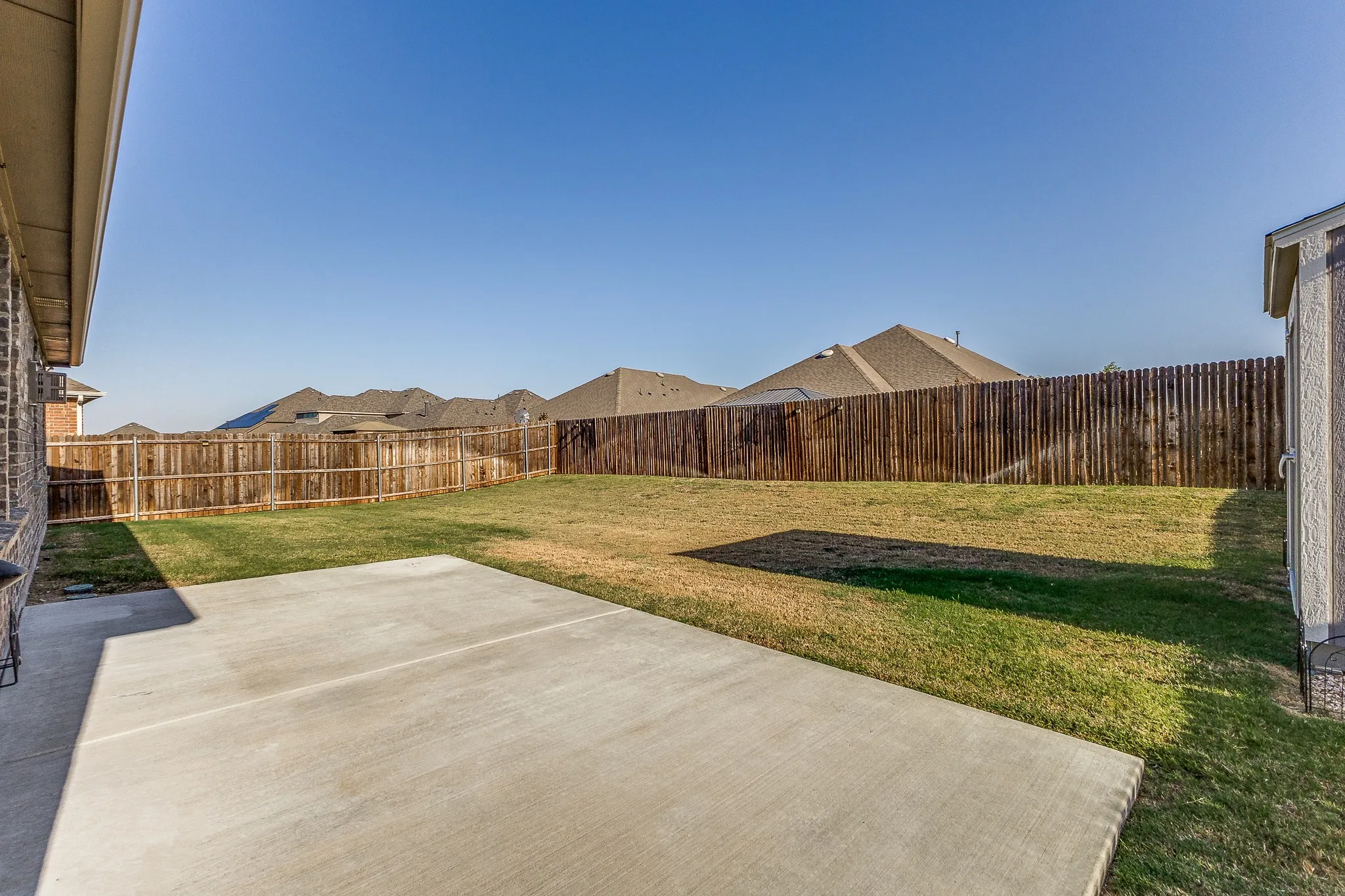 Extended Patio and Spacious Backyard