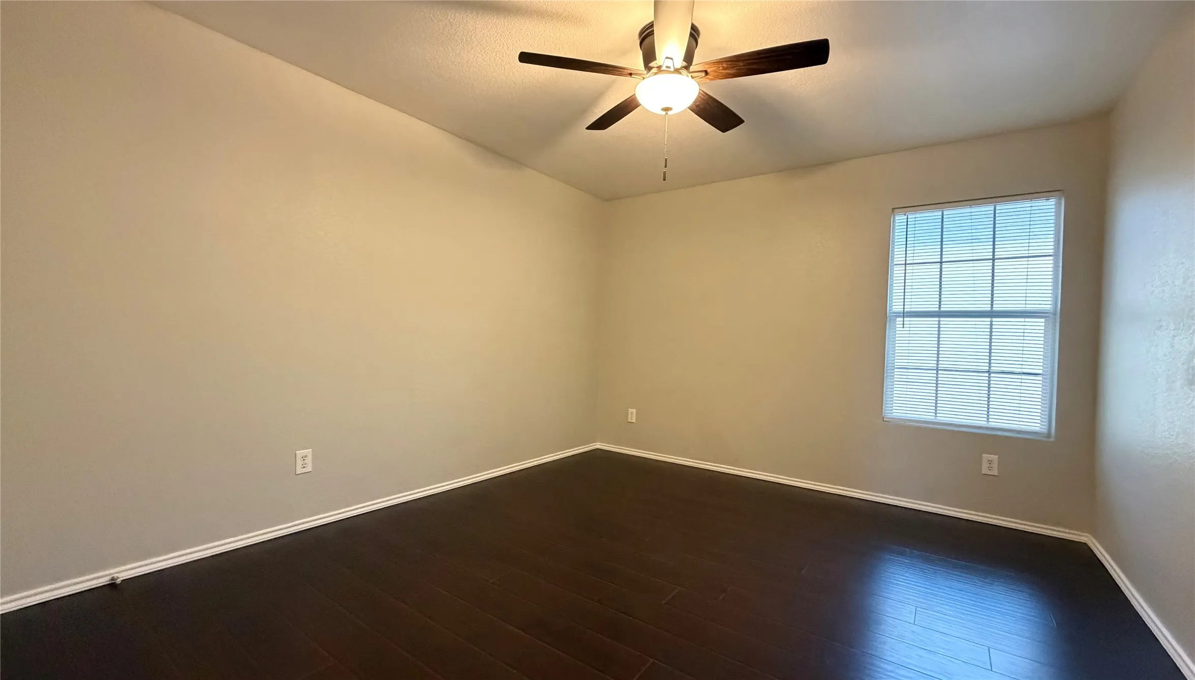 3rd bedroom upstairs wood-finish flooring, ceiling fan, and window with blinds