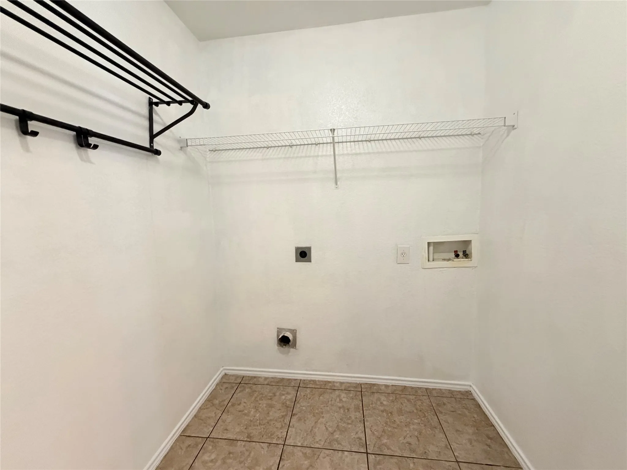 Tile flooring, wire shelving, and wall-mounted drying racks