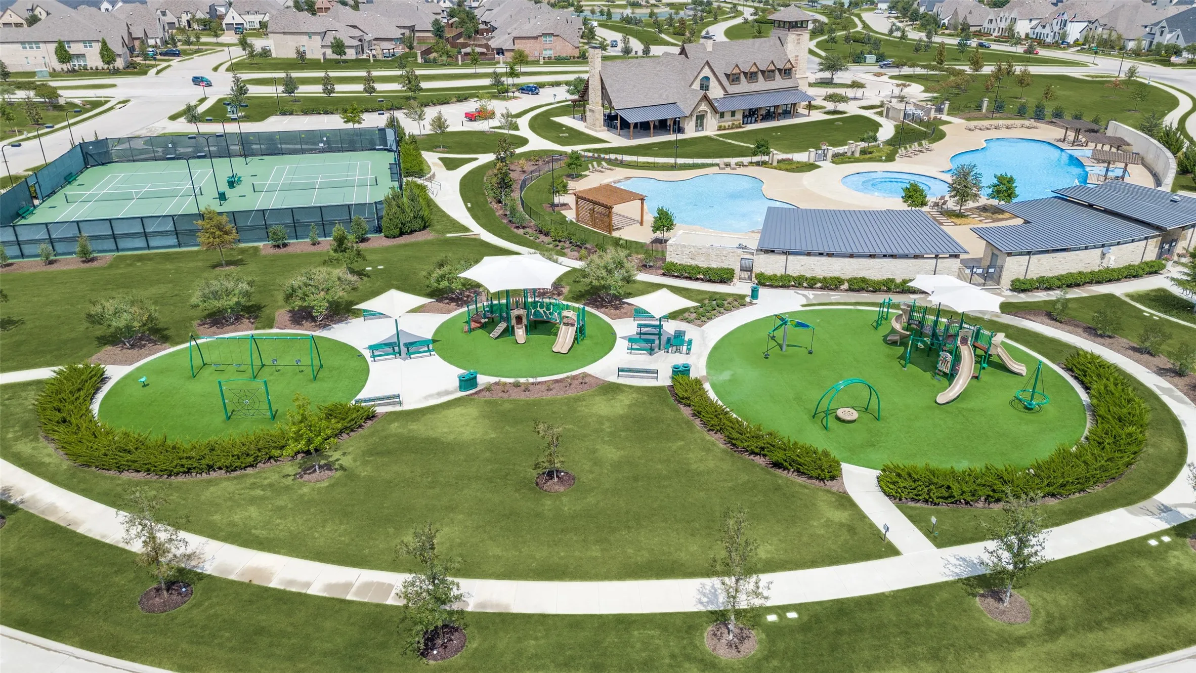 Community amenities include multiple swimming pools, tennis courts, playground areas with shade structures, and a clubhouse