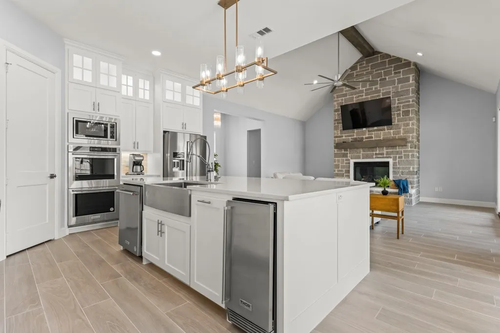 Open-concept living space with wood-finish flooring