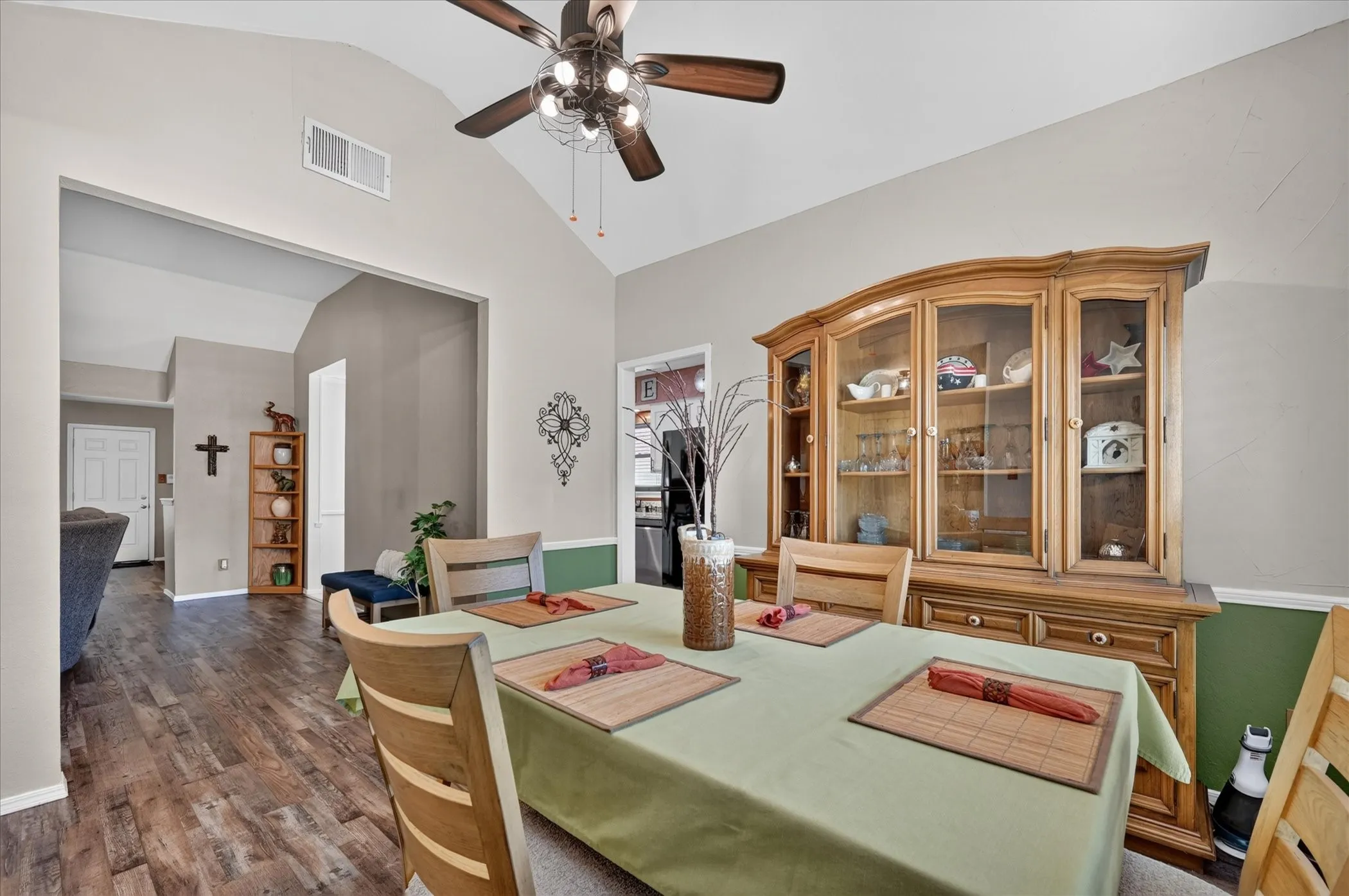 Spacious dining area offers an open connection to the main living spaces, highlighted by a vaulted ceiling and plenty of room for a full-size dining set.