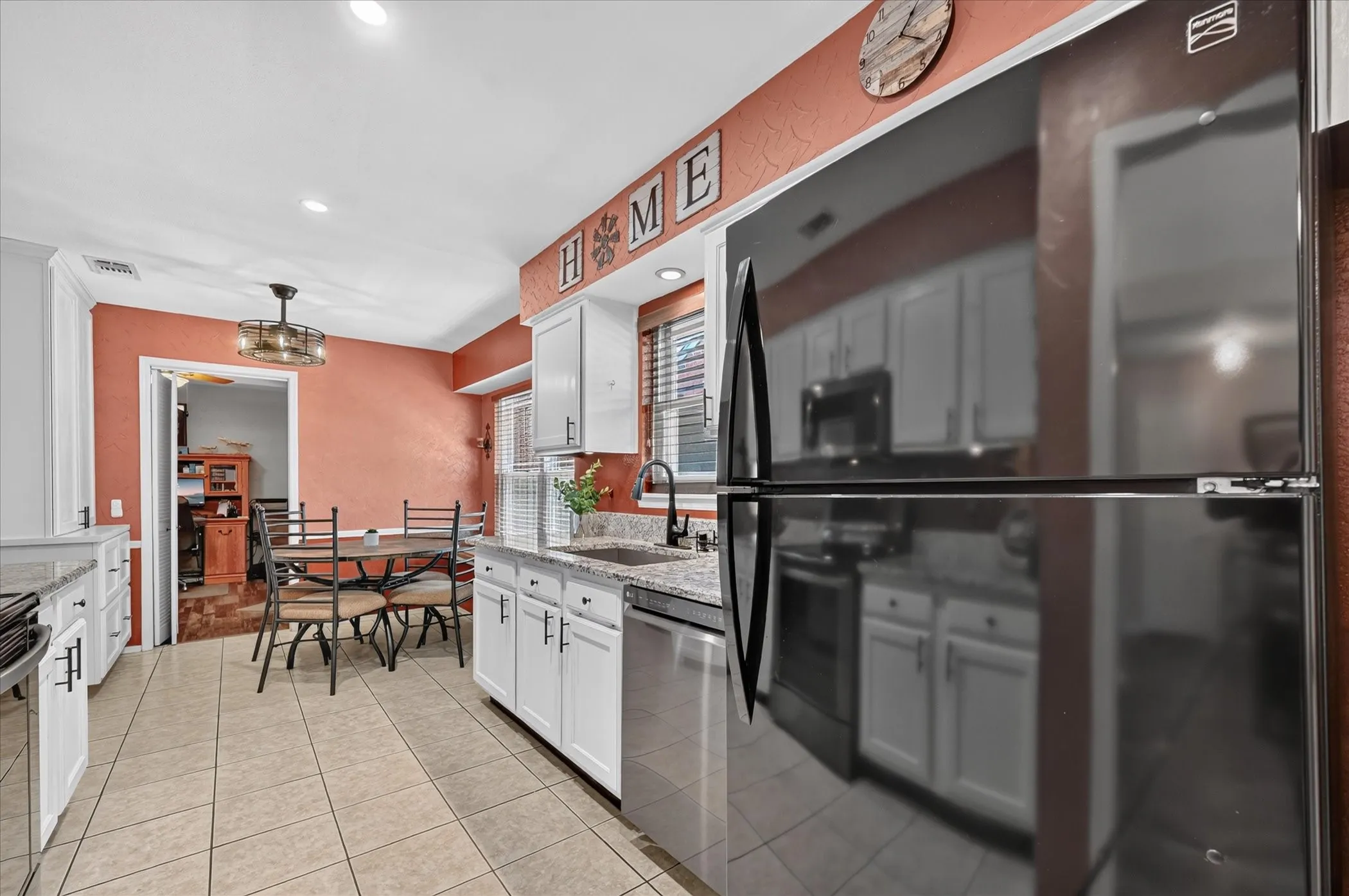 Functional kitchen layout offers generous cabinetry and counter space, with an adjoining breakfast area that creates an easy setting for casual dining.