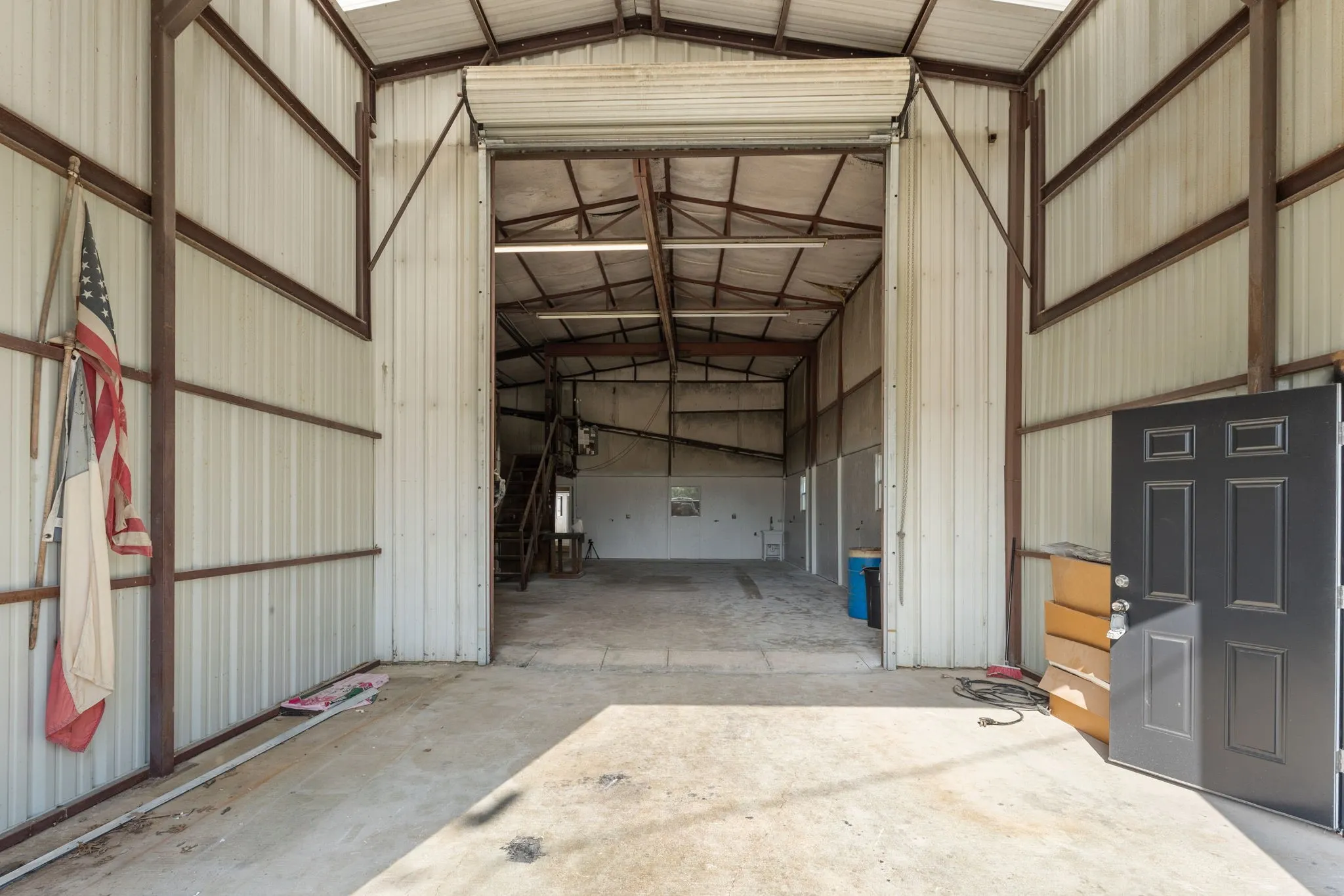 Covered entry into the 17 x 18 garage - ideal for staging, loading and unloading materials or equipment.