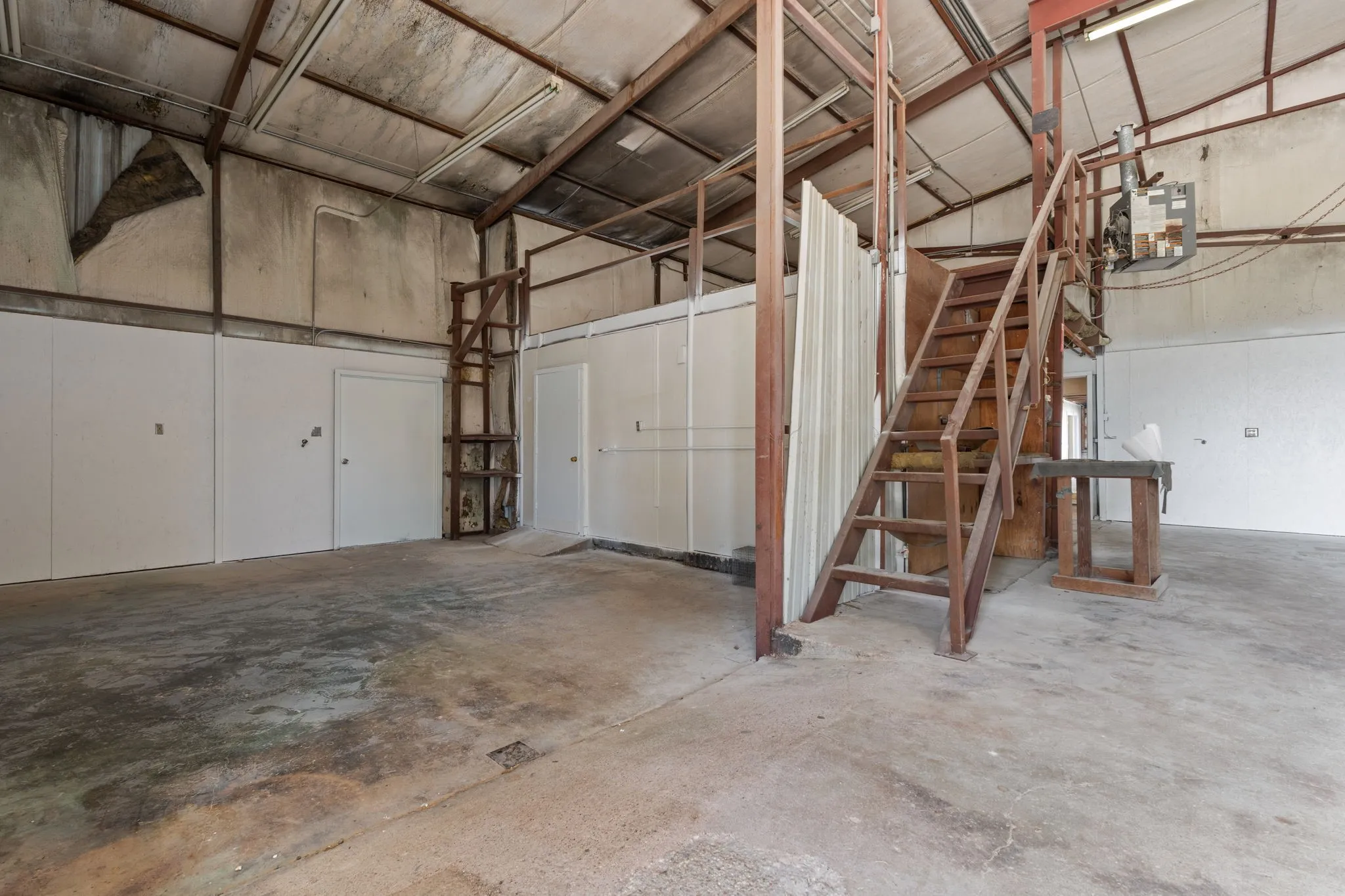 Expansive interior shop space provides excellent clearance and room for equipment, fabrication and storage.