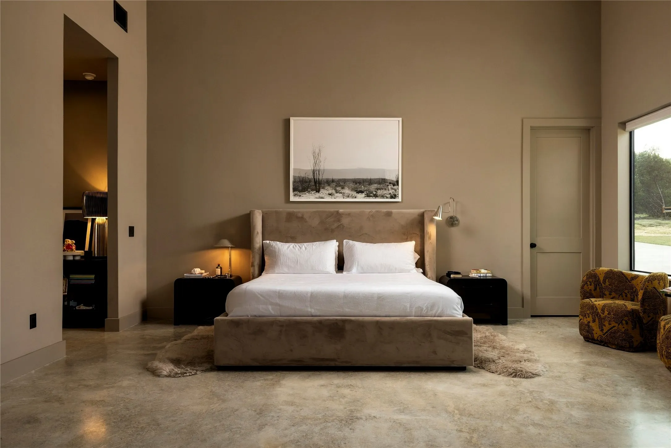 High ceilings and polished concrete flooring define this modern, minimalist retreat.