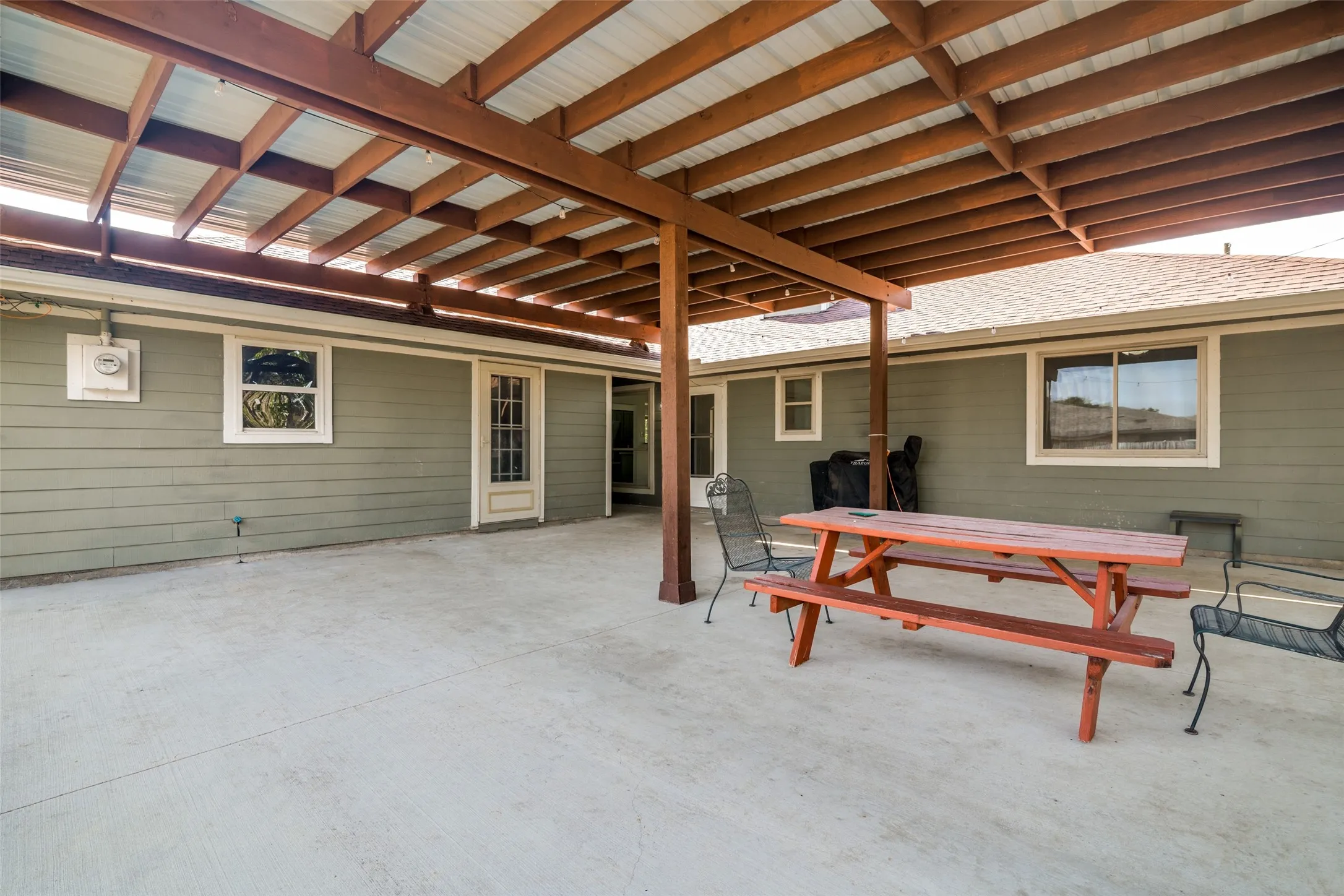 Expansive covered concrete patio.