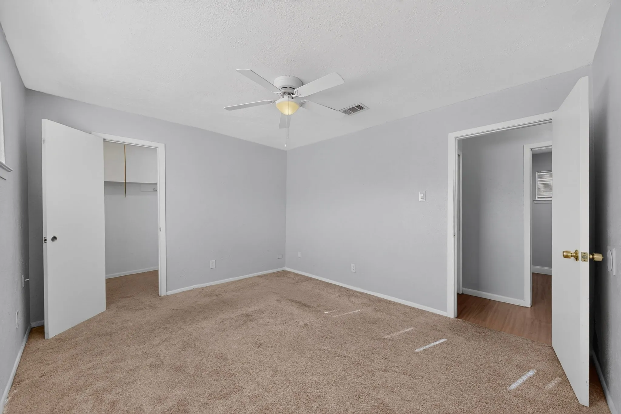 1427 bedroom upstairs showing closet and hall