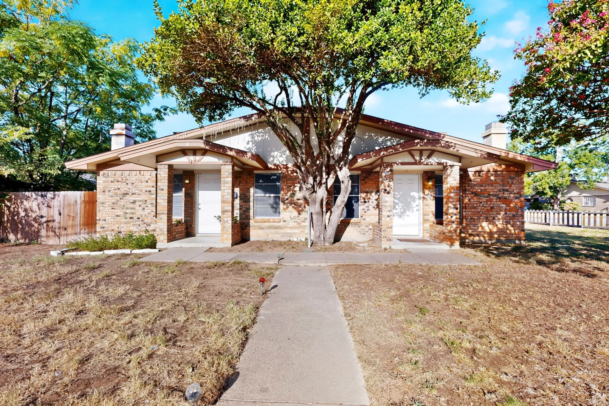 Front elevation looking over fence
