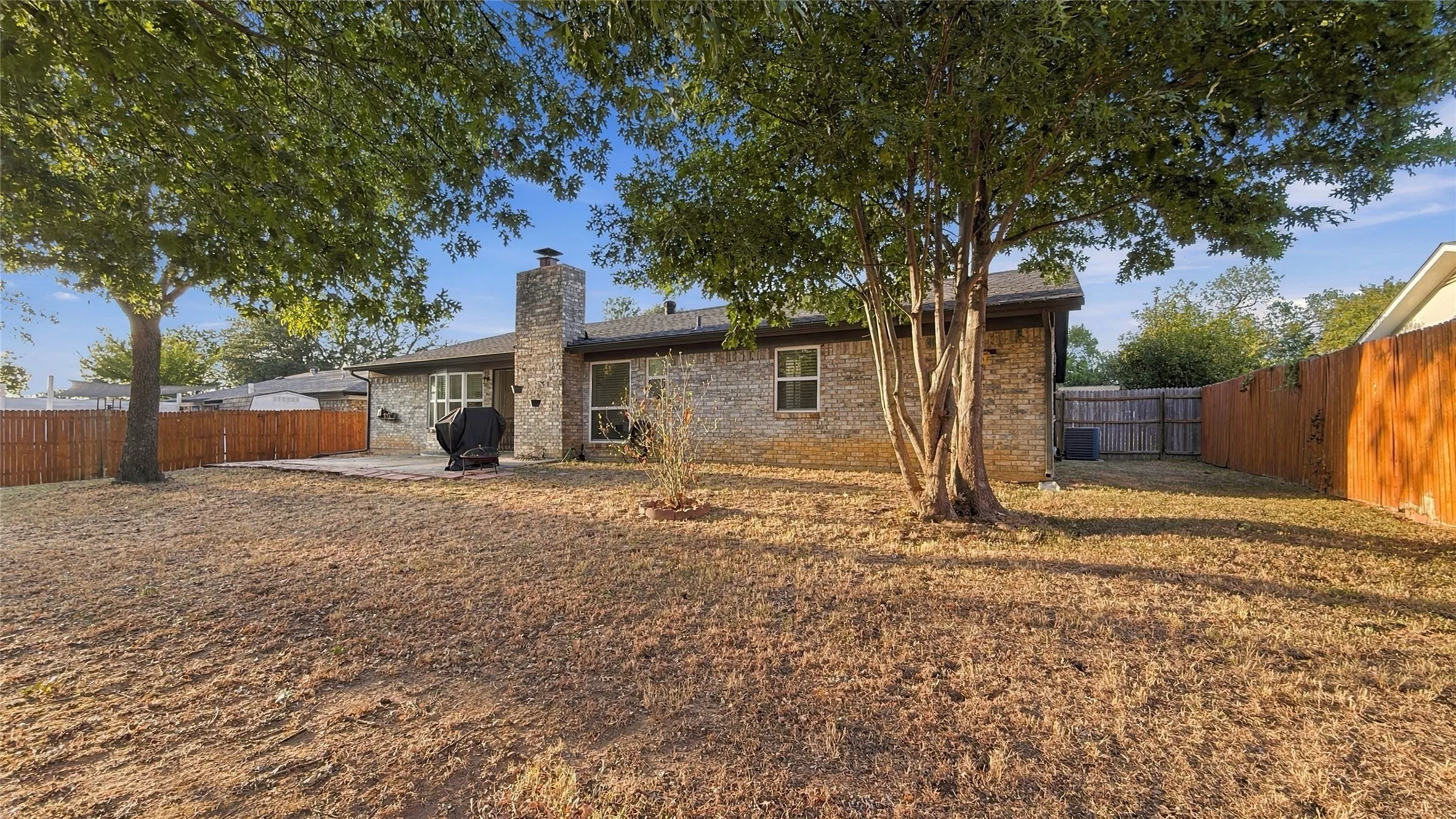 Another view of the backyard and house.