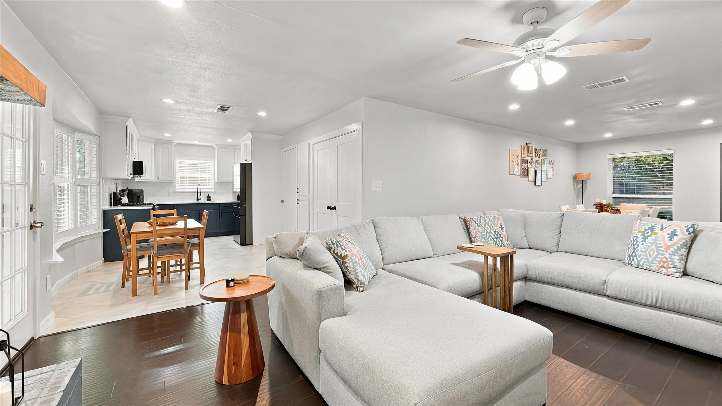 The living room is open to the breakfast area and kitchen.