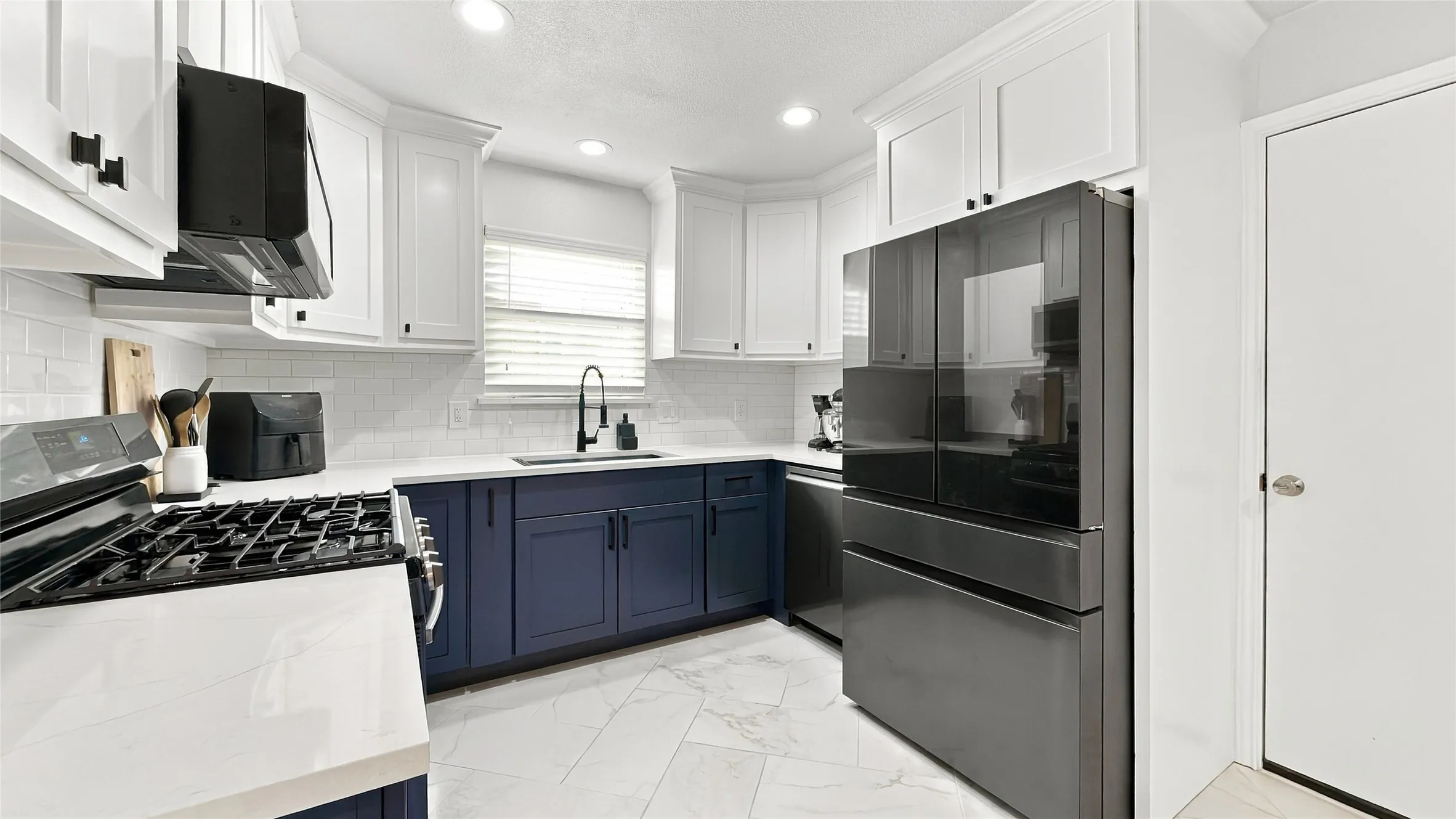 Nicely updated kitchen with quartz countertops.