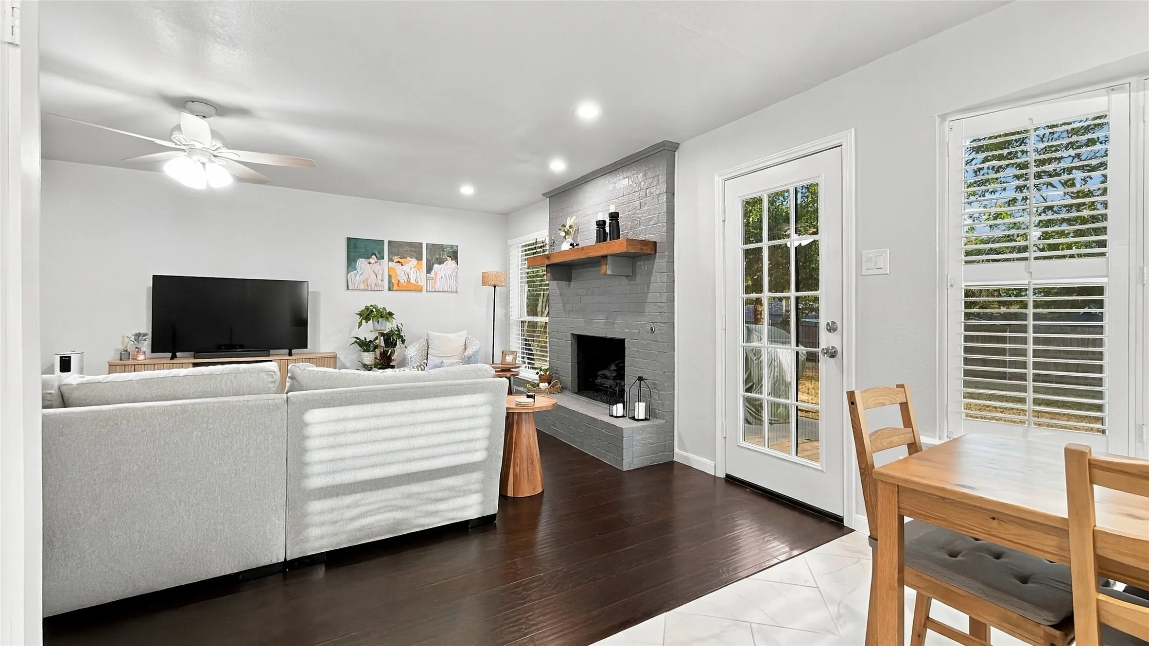 The view of the living room from the kitchen and breakfast nook.