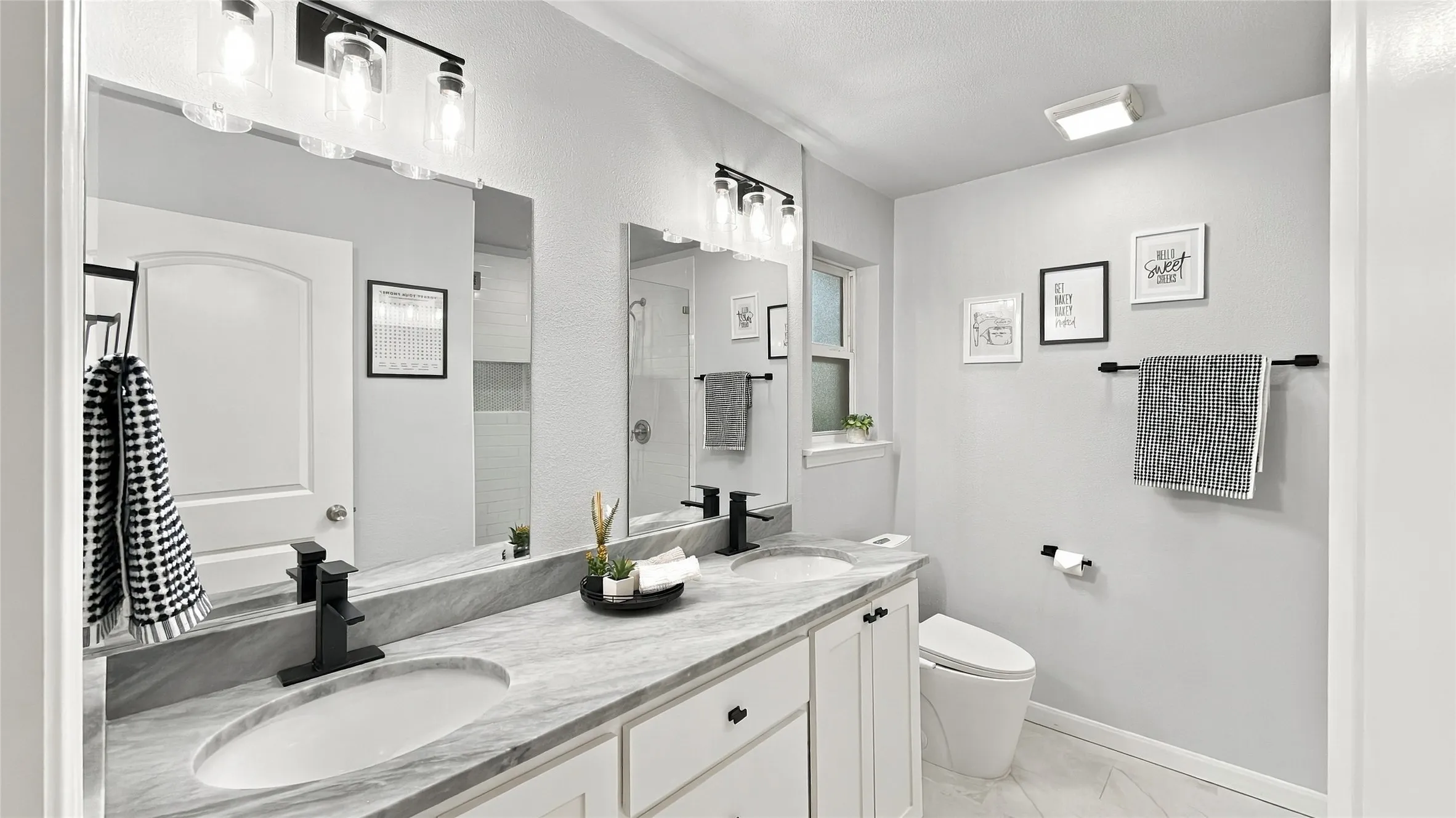 The primary bathroom is beautifully updated.
