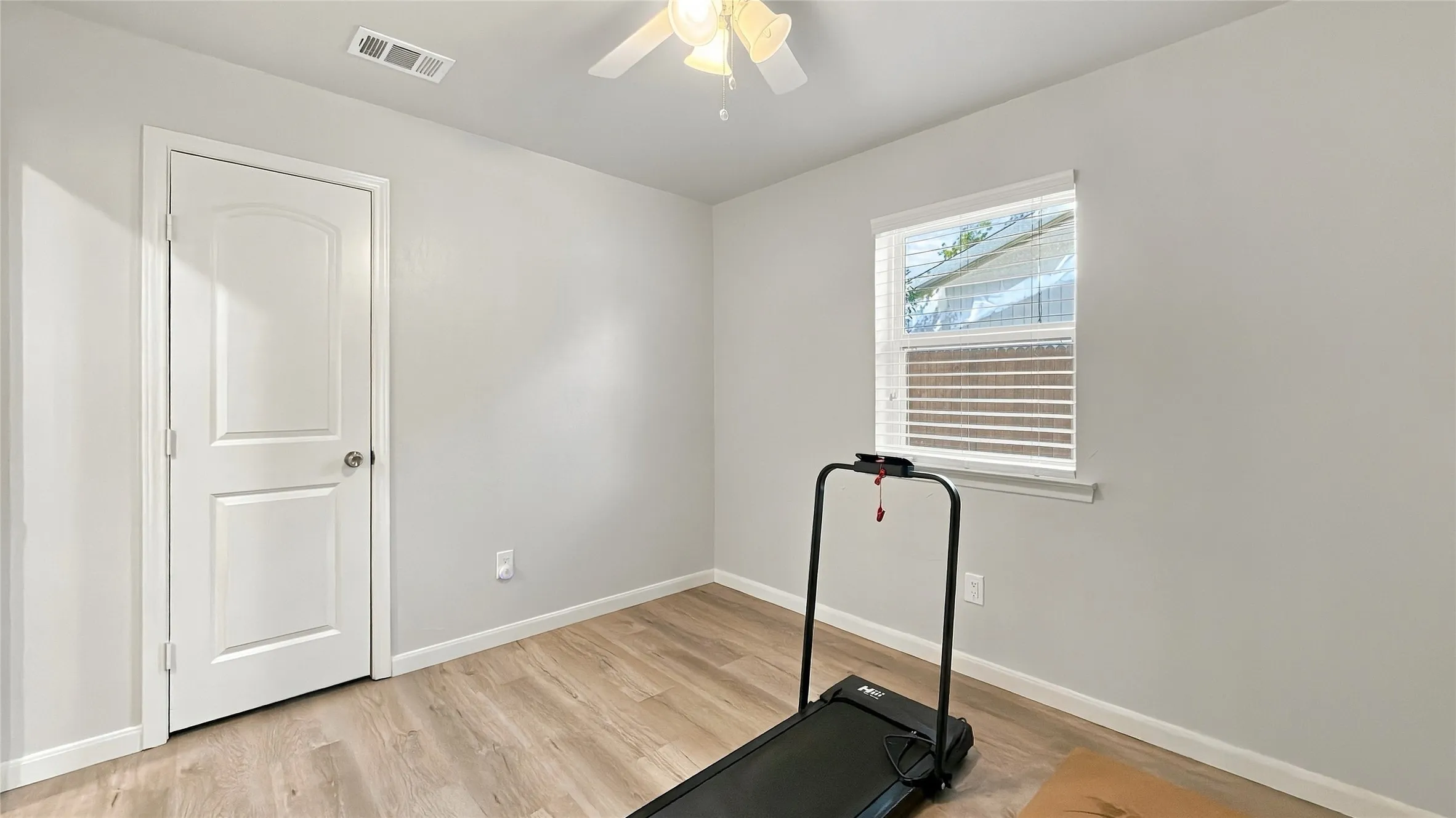 Bedroom 4 has a walk-in closet and is currently being used as an exercise room.
