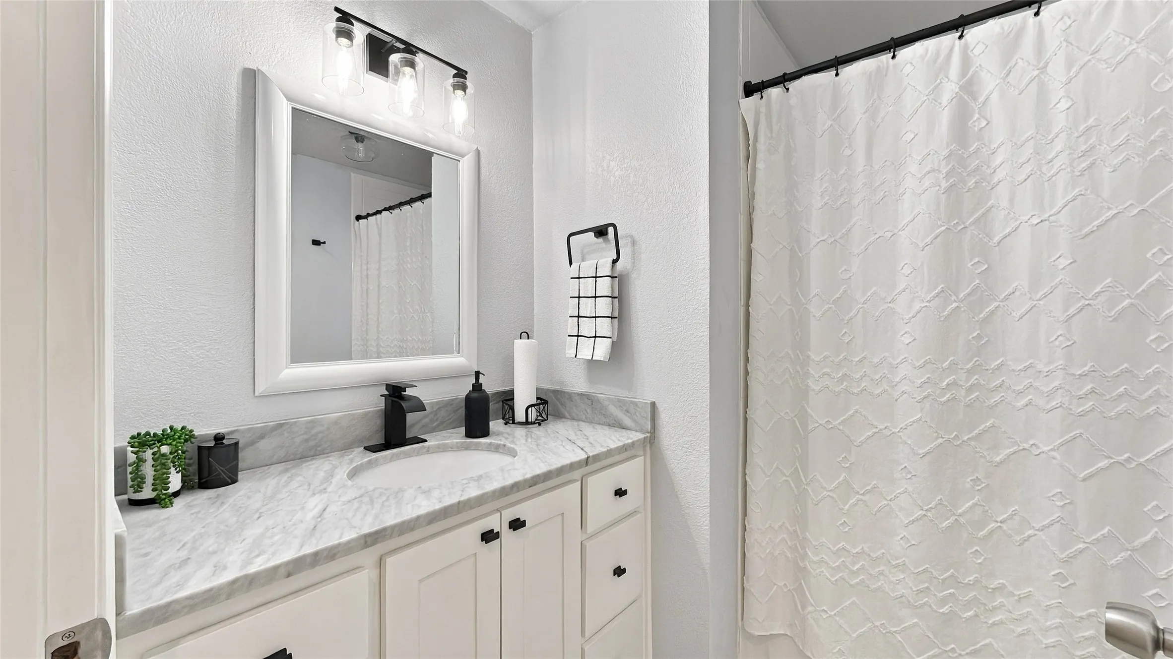 The secondary full bath is nicely updated