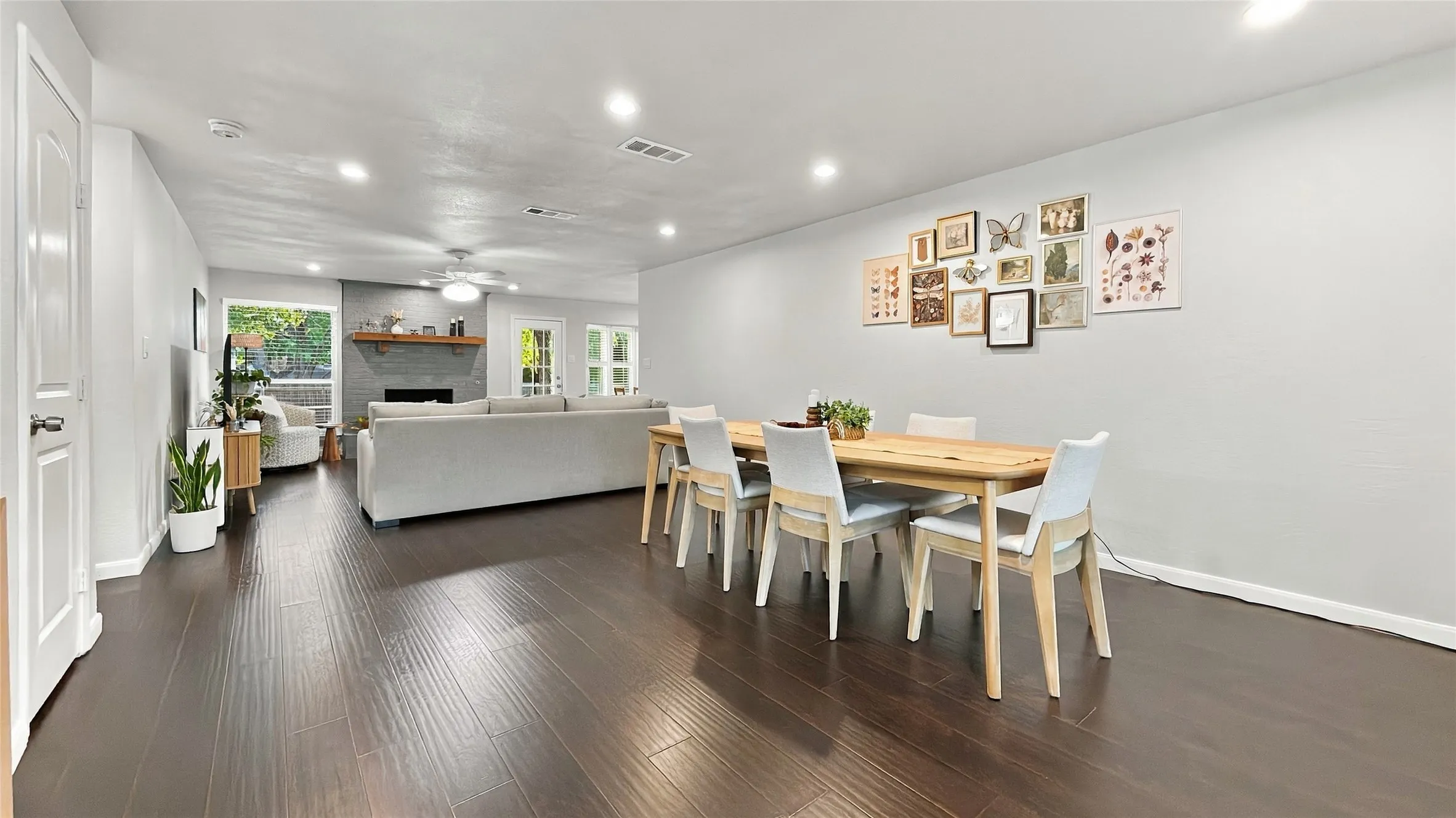 Entering the home is a dining area that is open to the living room.