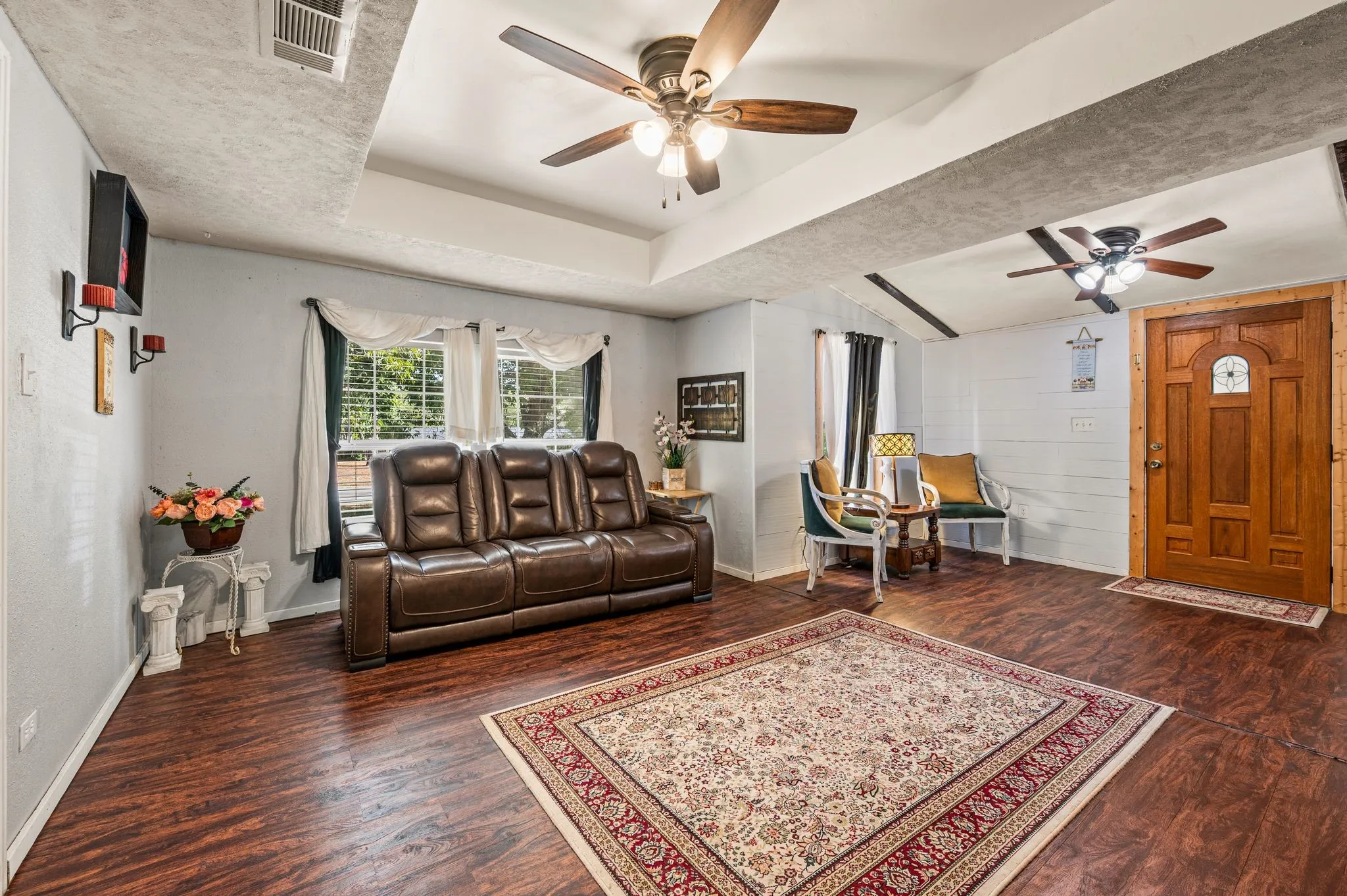  tray ceiling with a ceiling fan, and an additional ceiling fan