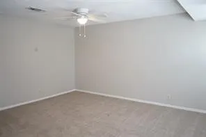 Neutral wall finishes and carpeted flooring
