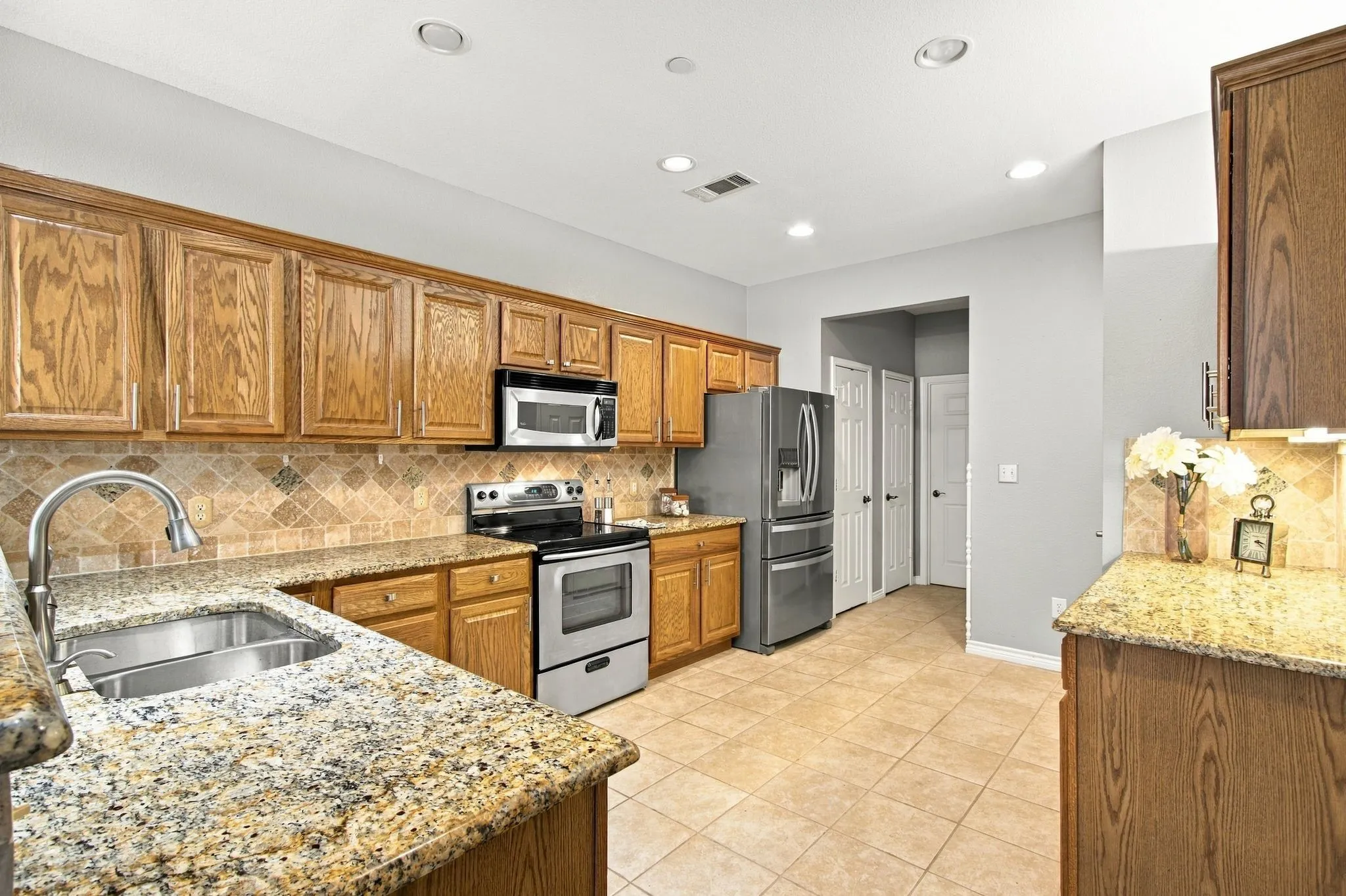 Cabinets galore along with lots of preparation area.