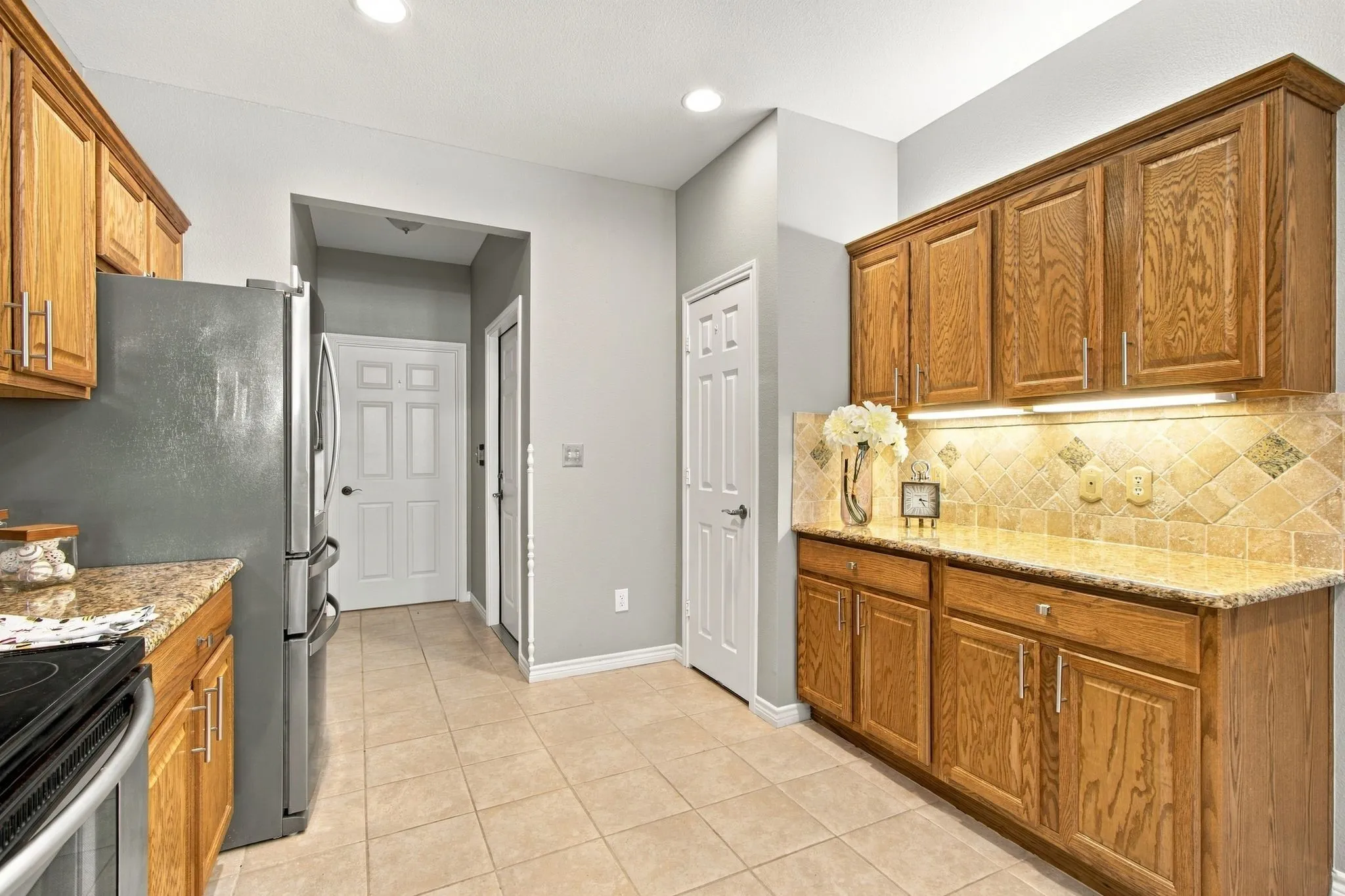 view Through the Kitchen to the Garage Door Entry on the right and Laundry Door Entry